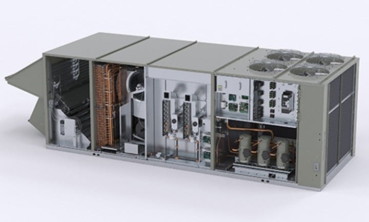 Plumber in gray uniform repairing an air conditioning unit with a screwdriver, ensuring optimal performance and comfort in the home