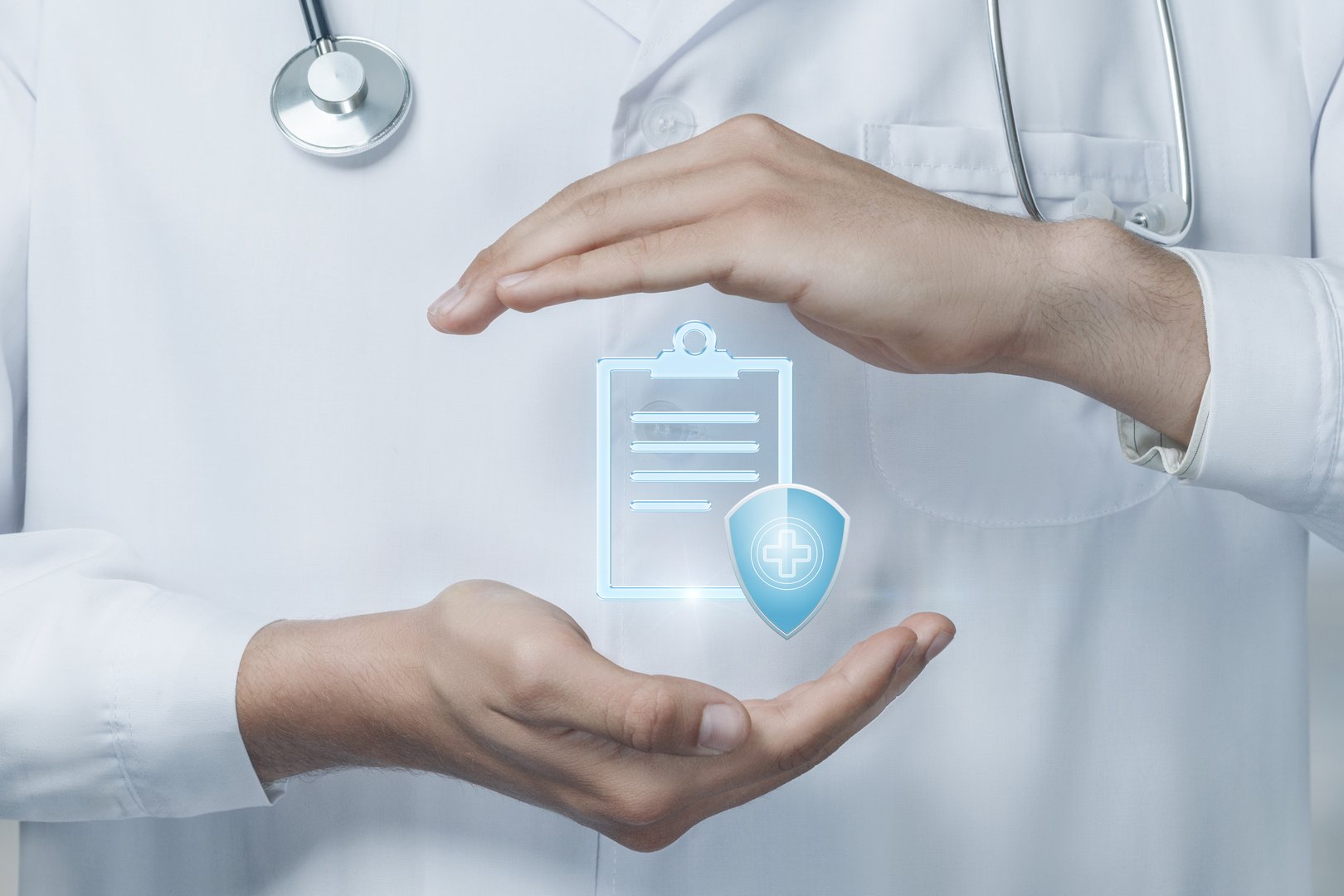 A healthcare professional is emphasizing the significance of medical insurance while holding a digital representation of patient documentation and a protective shield symbolizing coverage.