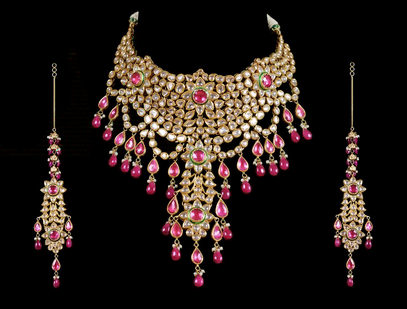 Close up of diamond necklace  multicolored gemstone  on black background with diamond ear ring