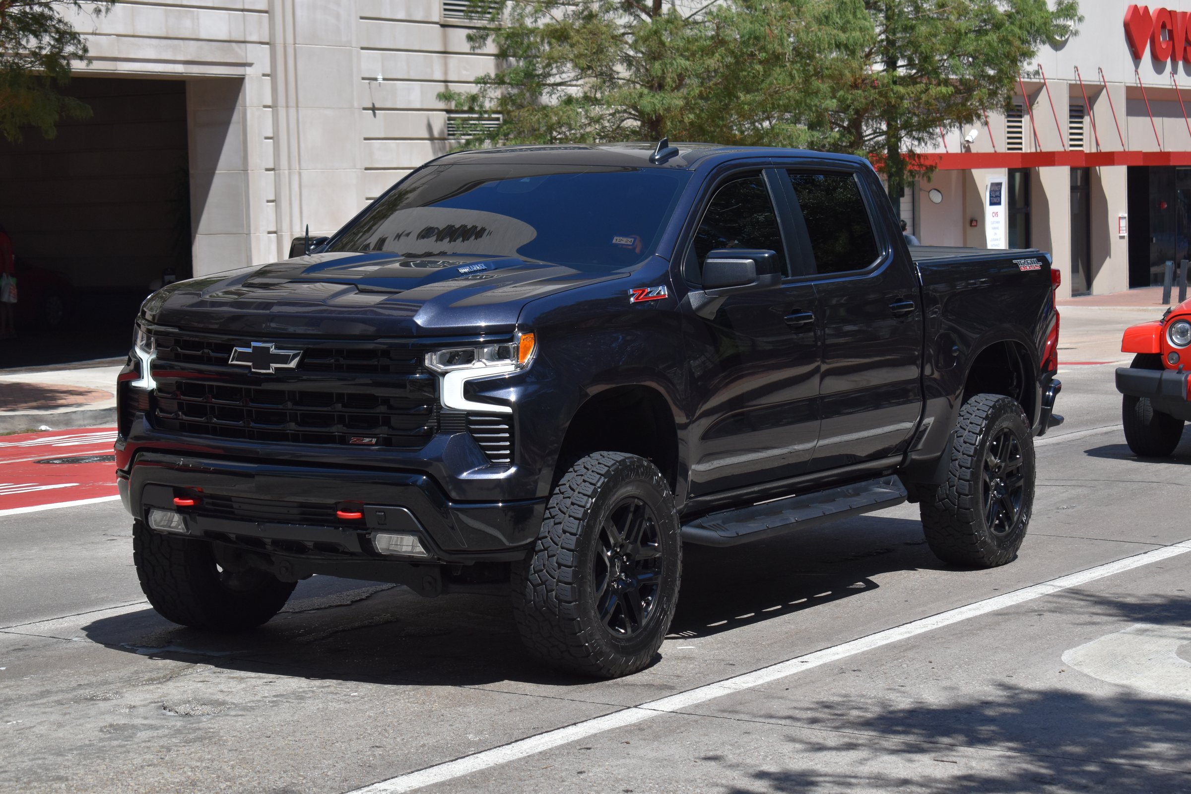 Houston TX USA 9-9-2024 - A portrait of a black Chevy Silverado pick-up truck cruising in the downtown financial district