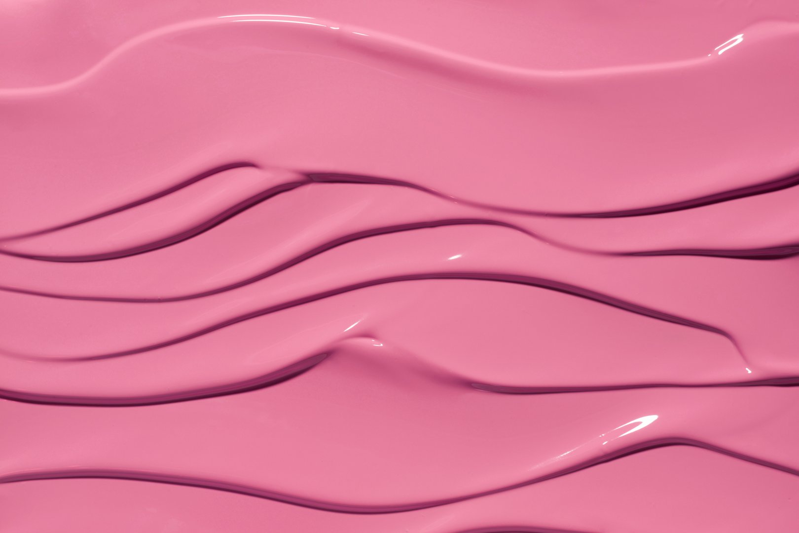 Lip gloss or liquid lipstick opaque texture sample. Thick pink surface