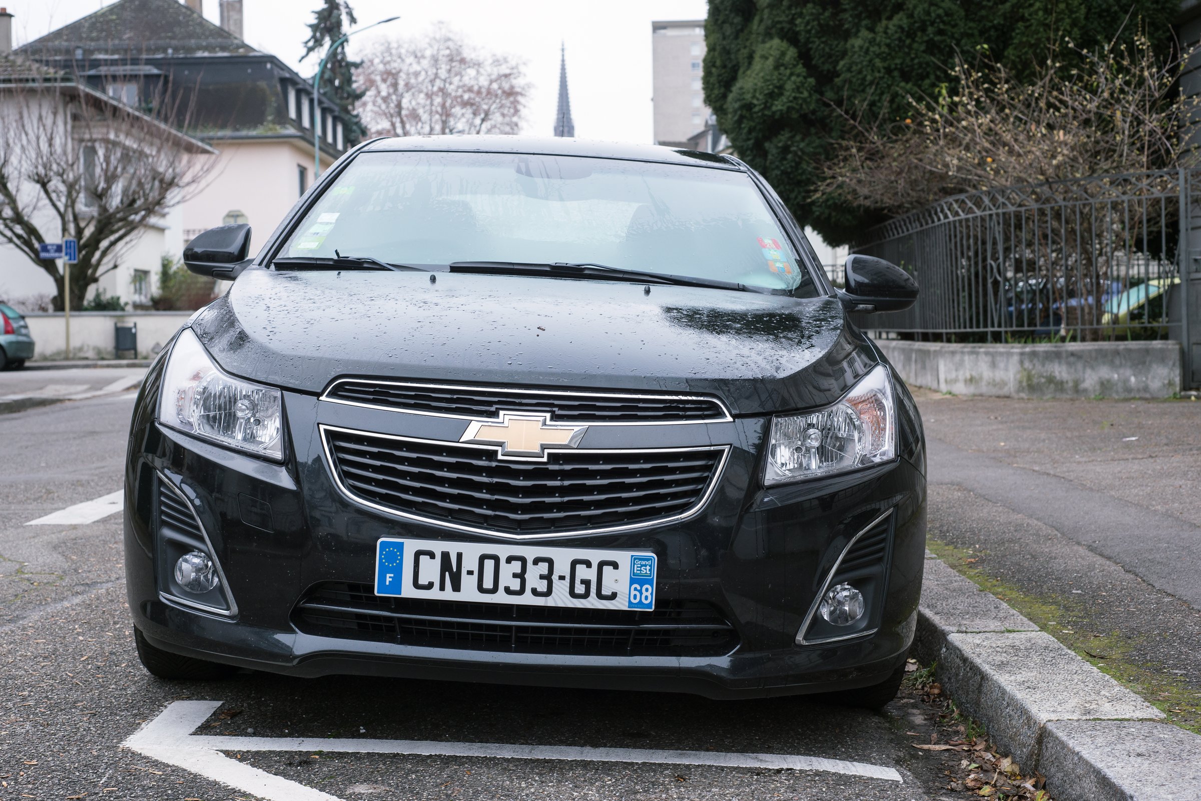 Black Chevrolet Cruze parked on the street