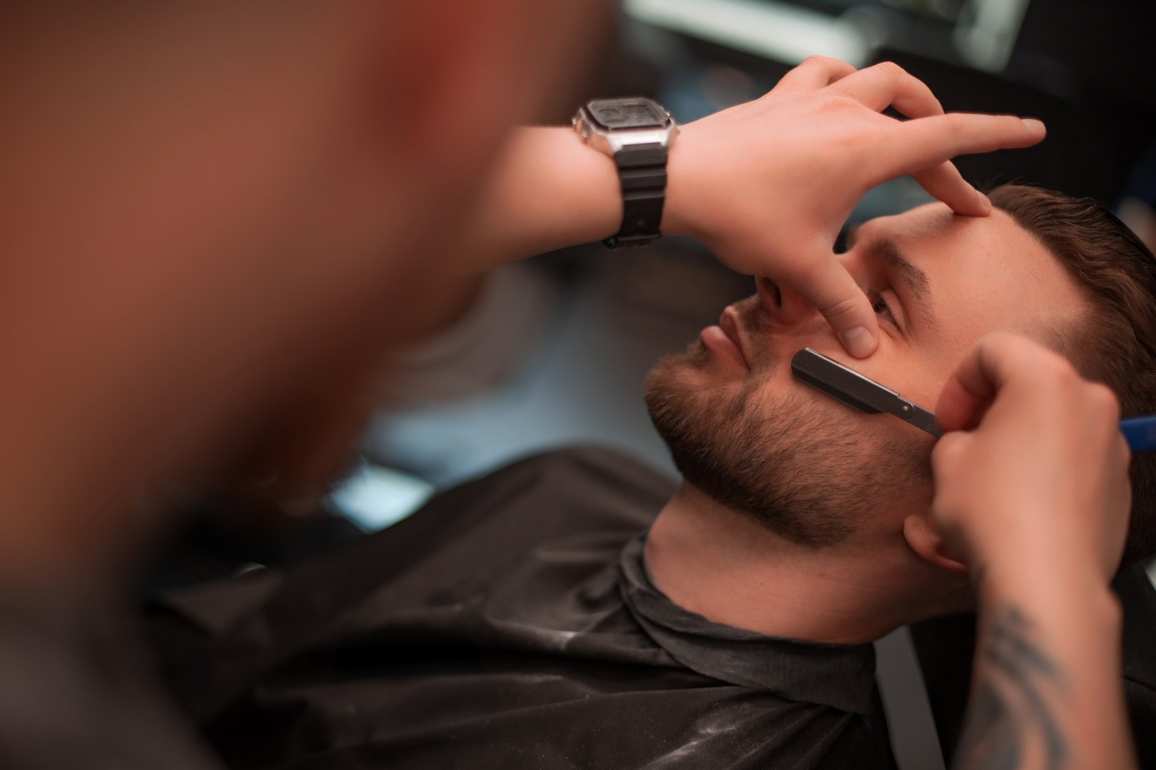 Straight razor shave in modern barbershop