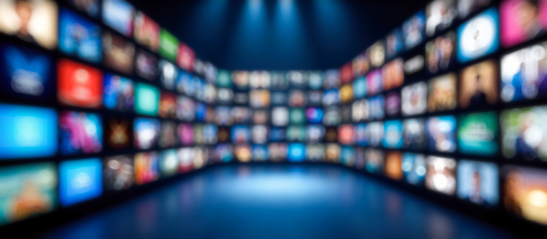 Blurred background streaming service interface with colorful app icons on blue background technology entertainment digital content