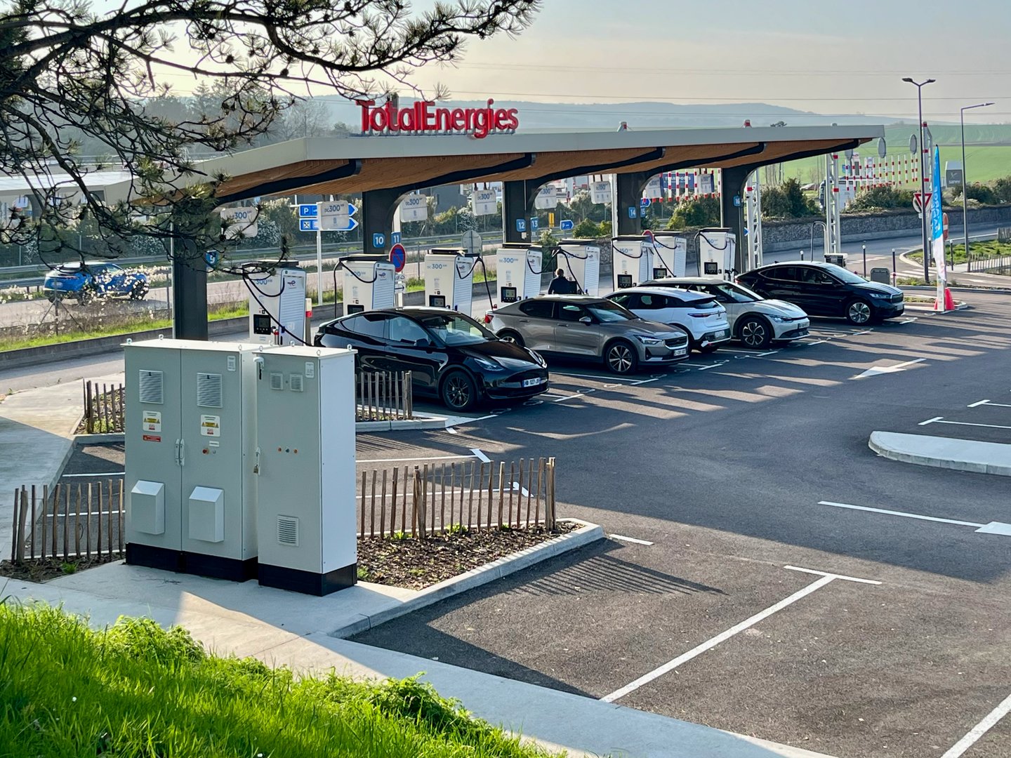 Reims, France - 03/28/2025: Modern TotalEnergies electric vehicle charging station with multiple cars connected to chargers
