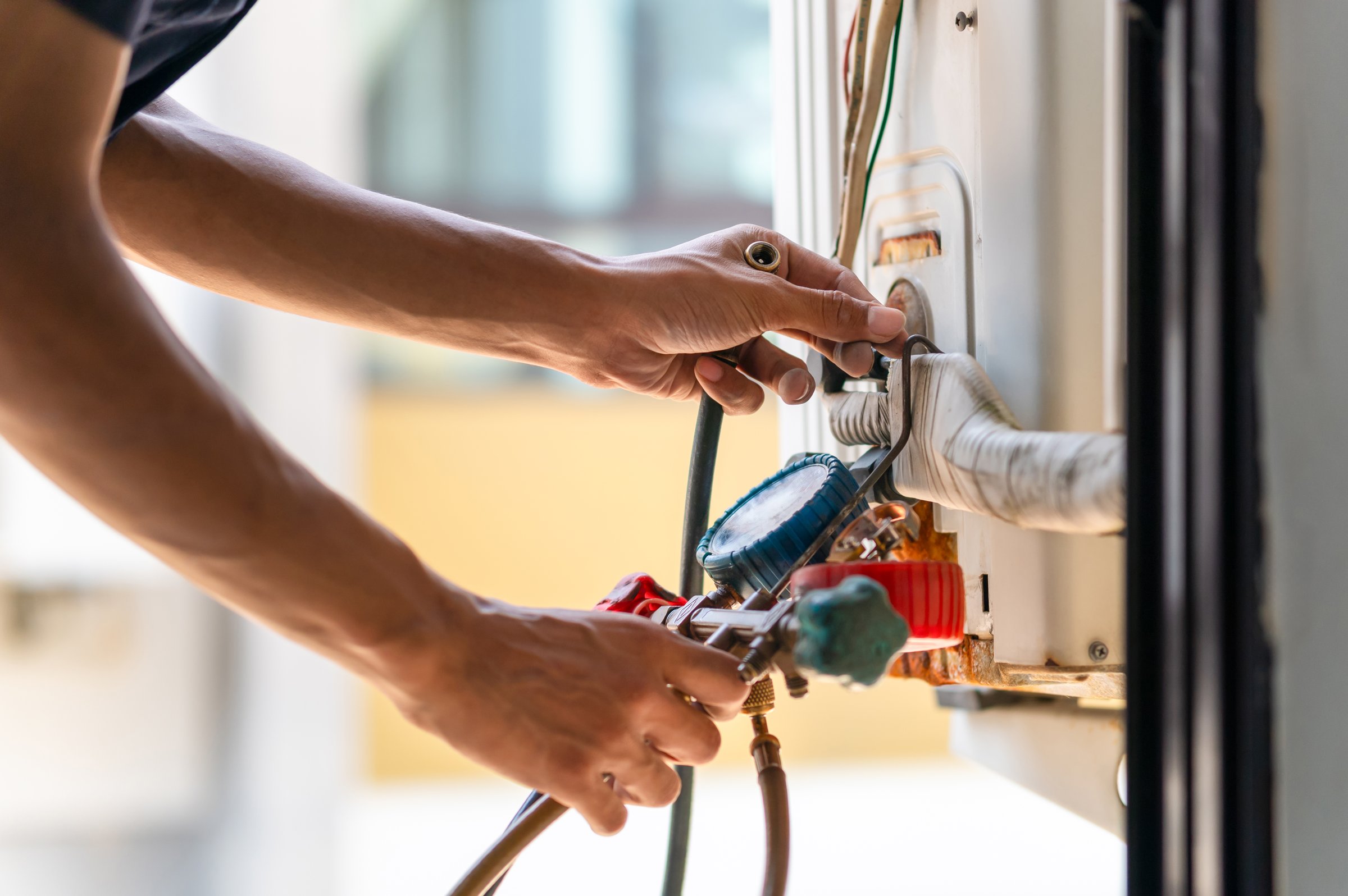 Repairman fix air conditioning systems, Male technician service for repair and maintenance of air conditioners