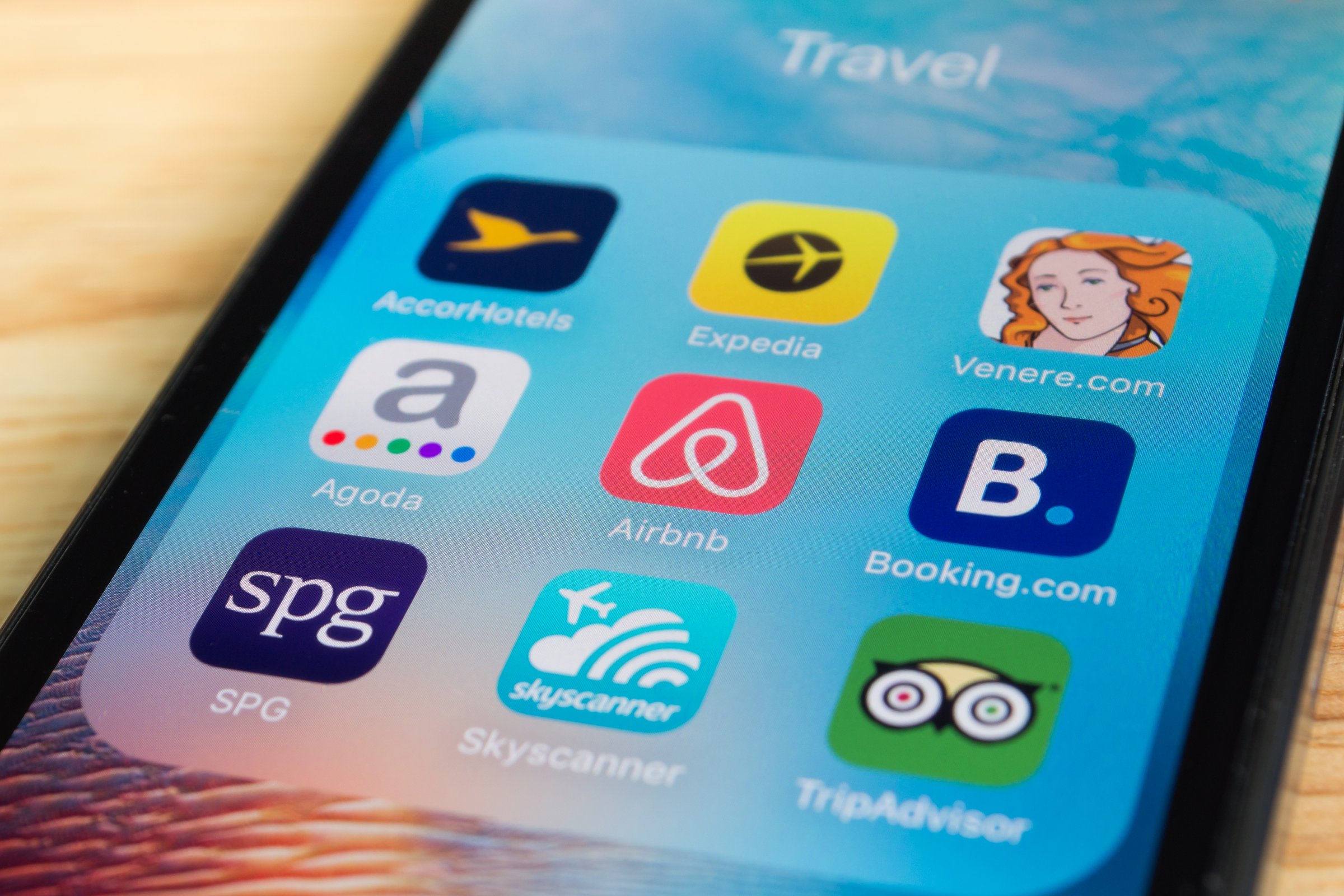 Bangkok, Thailand - June 6, 2016 : Apple iPhone5s showing its screen with popular travel applications.