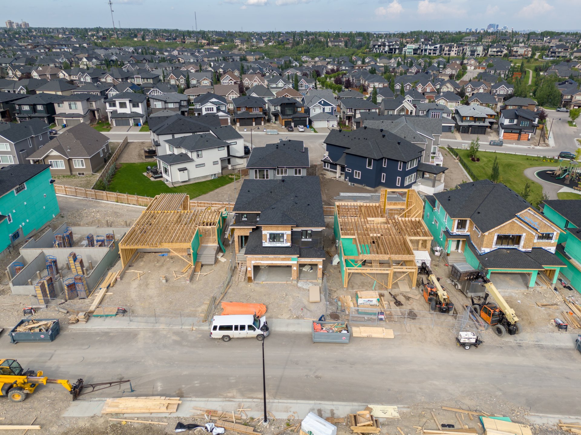 Aerial view of new home construction in Aspen Estates, Calgary.
