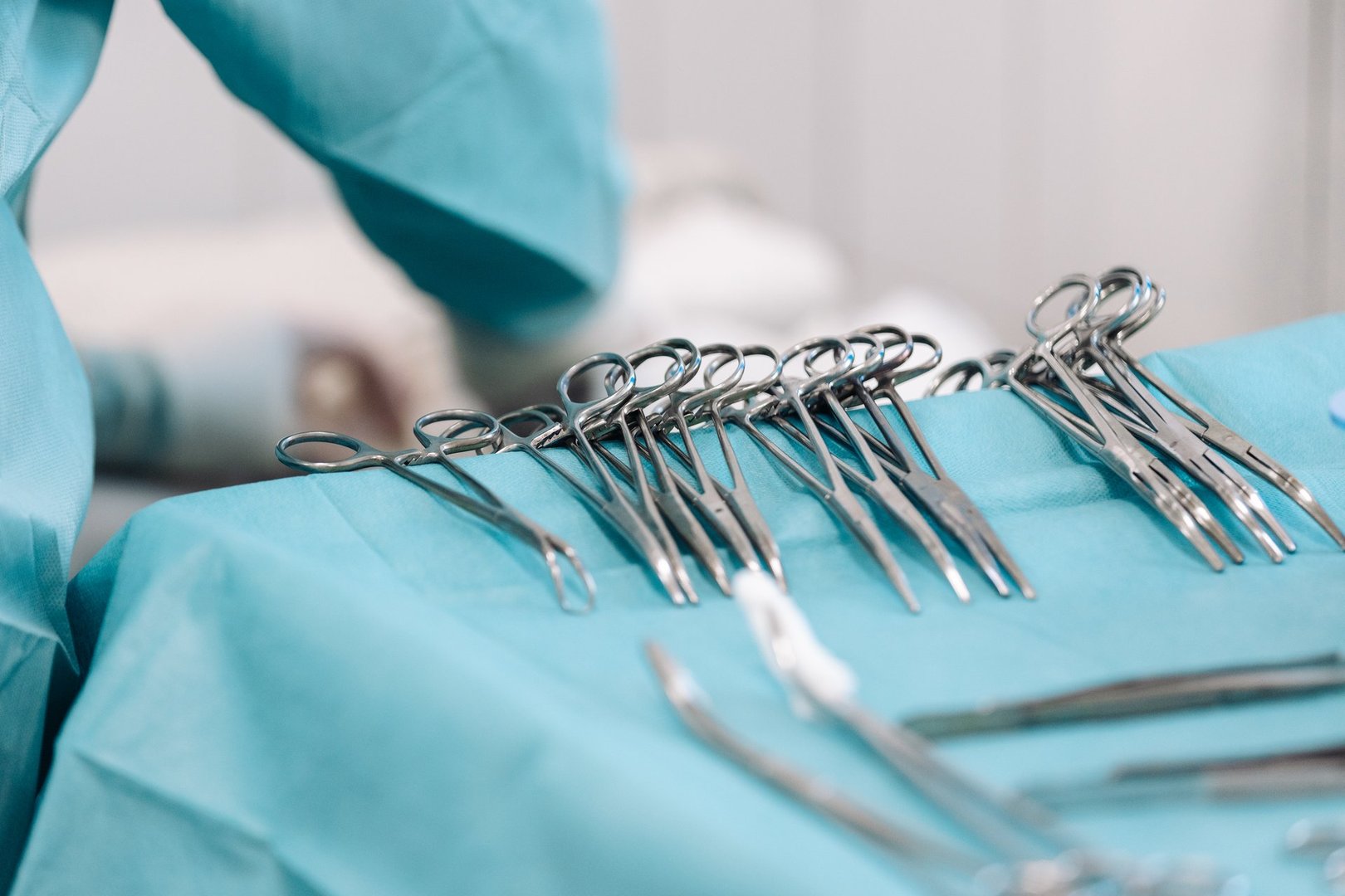 Close-up of sterile surgical instruments during surgery in the operating room. Concept of precision and professionalism in medical practice.