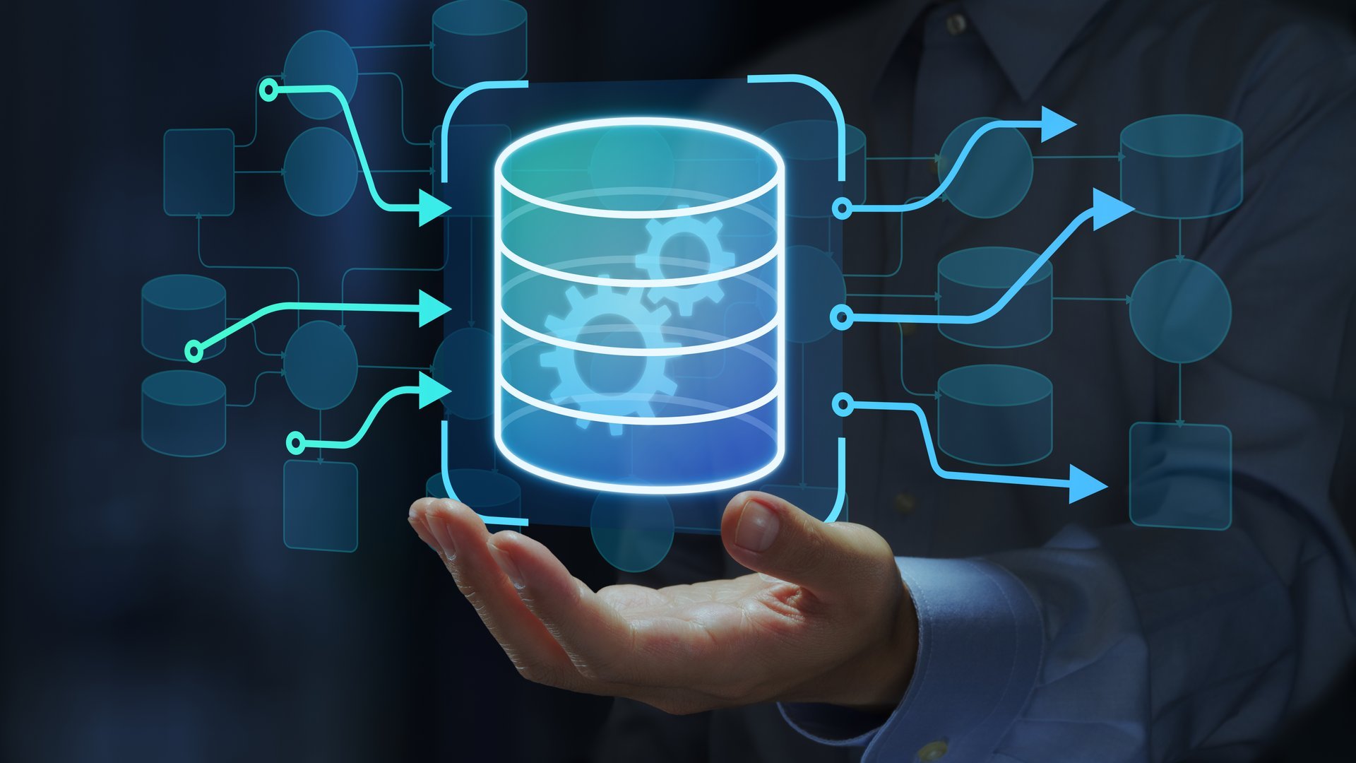 Engineer holding database icons in data flow diagram.