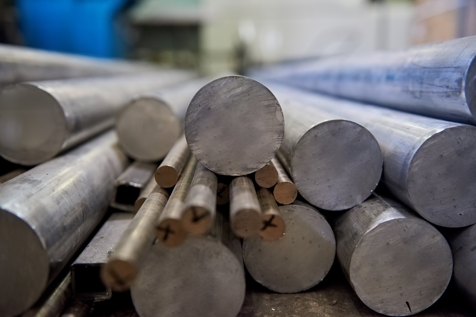 Pile of aluminium rods. Metal bars close up. Buy aluminium online.