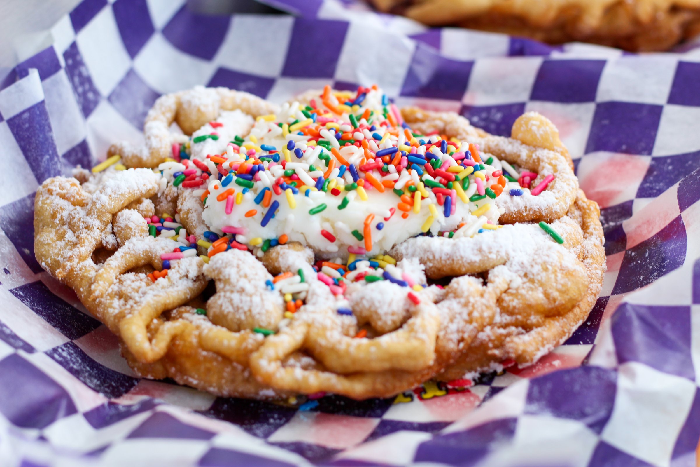 Close-Up of Freshly Made Fairground Funnel Cake with Powdered Sugar
