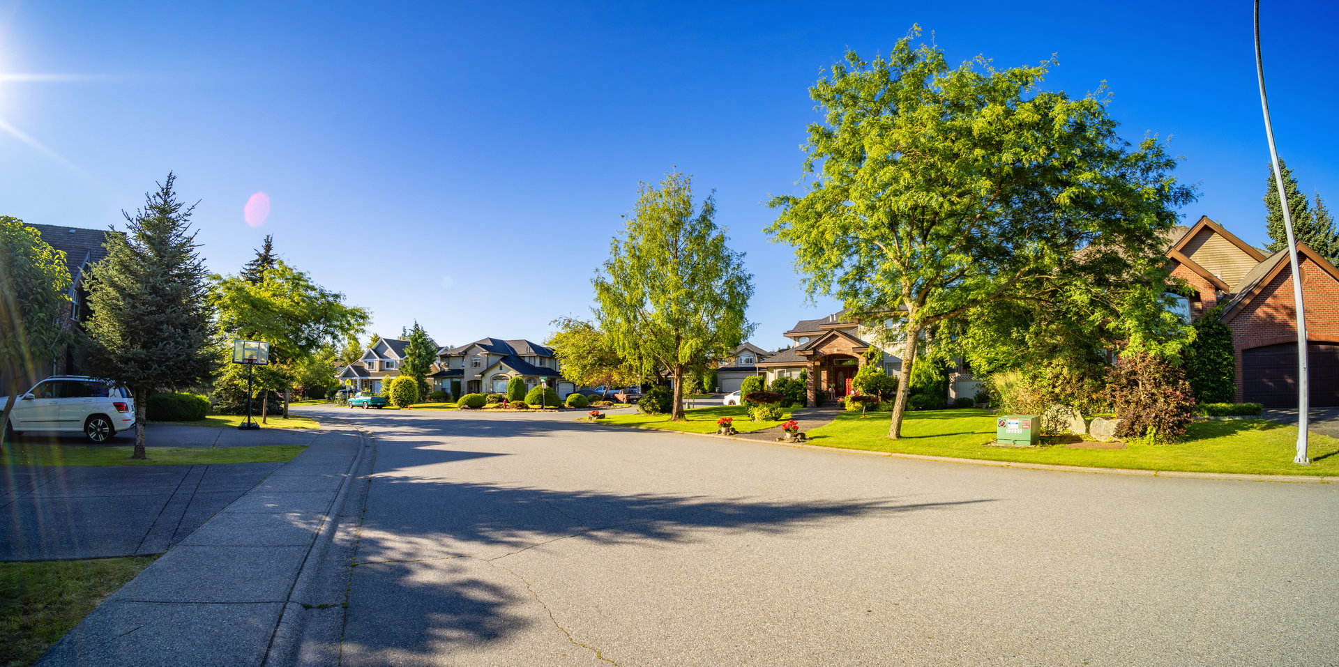 Residential Homes in a suburban city street sunny morning. Surrey, Vancouver, BC, Canada.