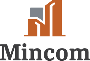 Logo with an abstract building design in orange and gray above the text Mincom in bold, dark gray font.