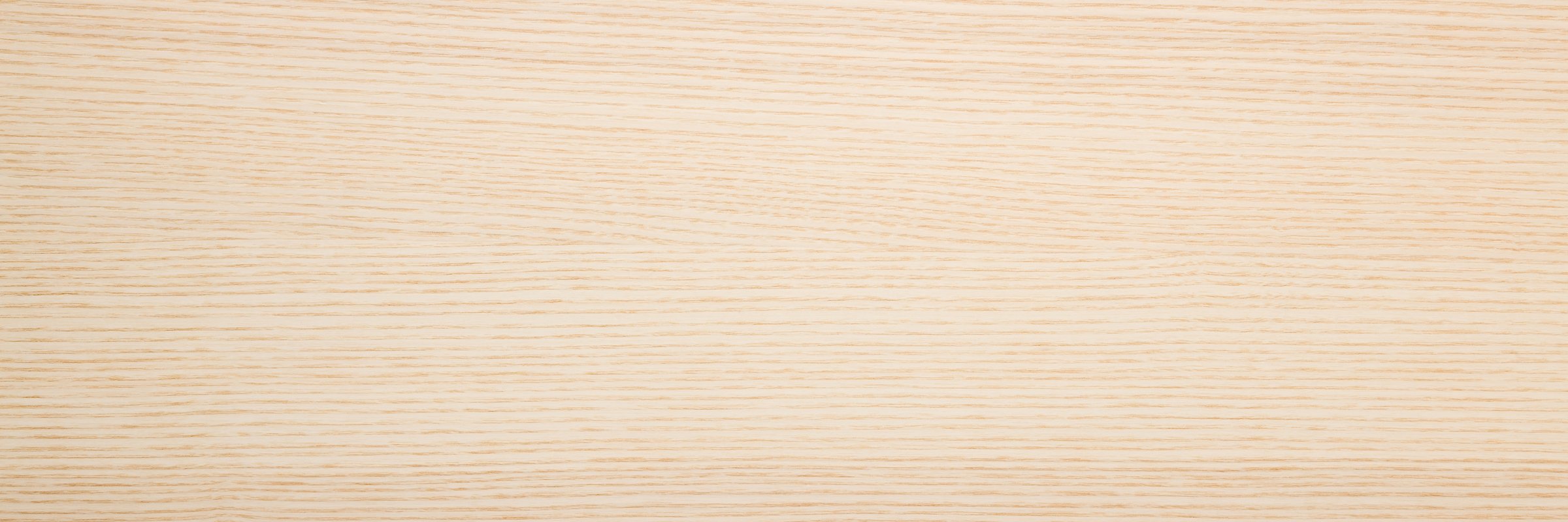 Light ash veneer wooden surface background. Closeup. Empty place for text. Wide banner. Top down view.