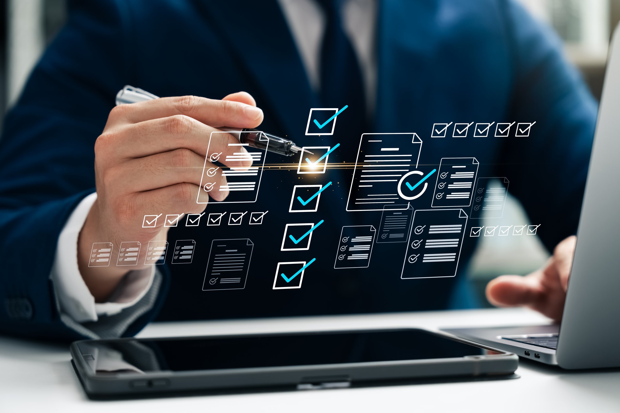 Business performance checklist and tracking, businessman using laptop and tablet Take online digital form checklist surveys, fill out online survey forms, assessment questionnaires.