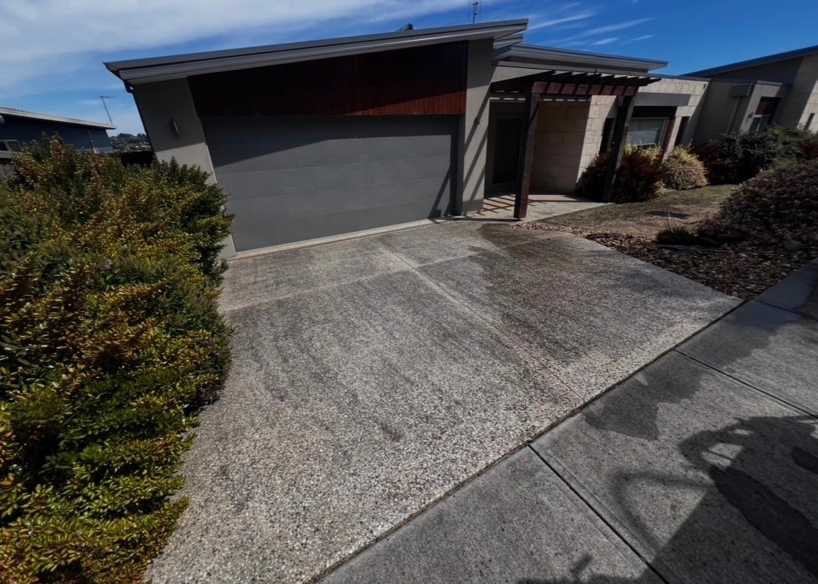 Dirty driveway before cleaning