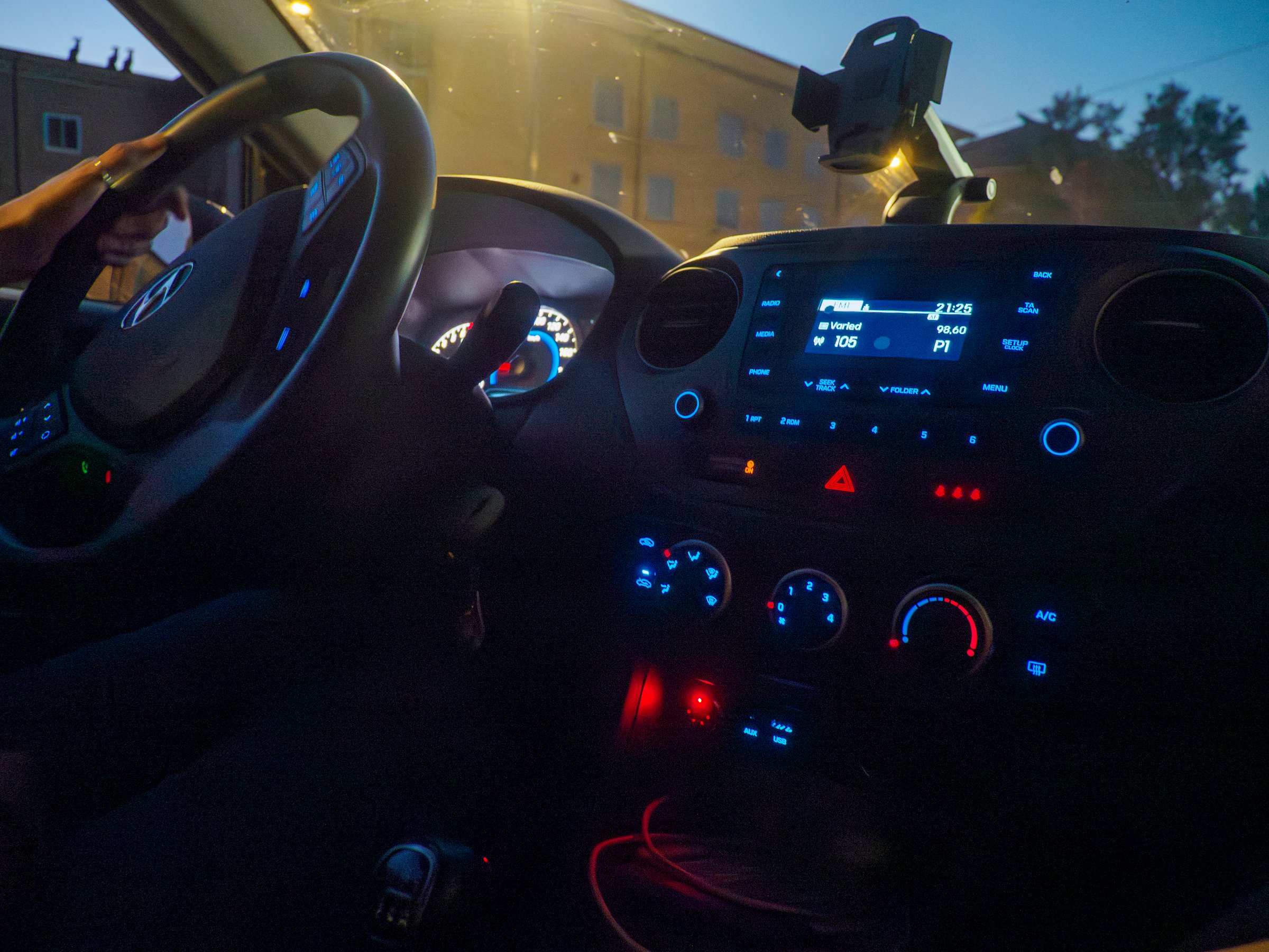 Cremona, Italy - July 28th 2025 Illuminated car dashboard at night with glowing blue and red lights highlighting the controls and steering wheel creating a modern interior ambiance