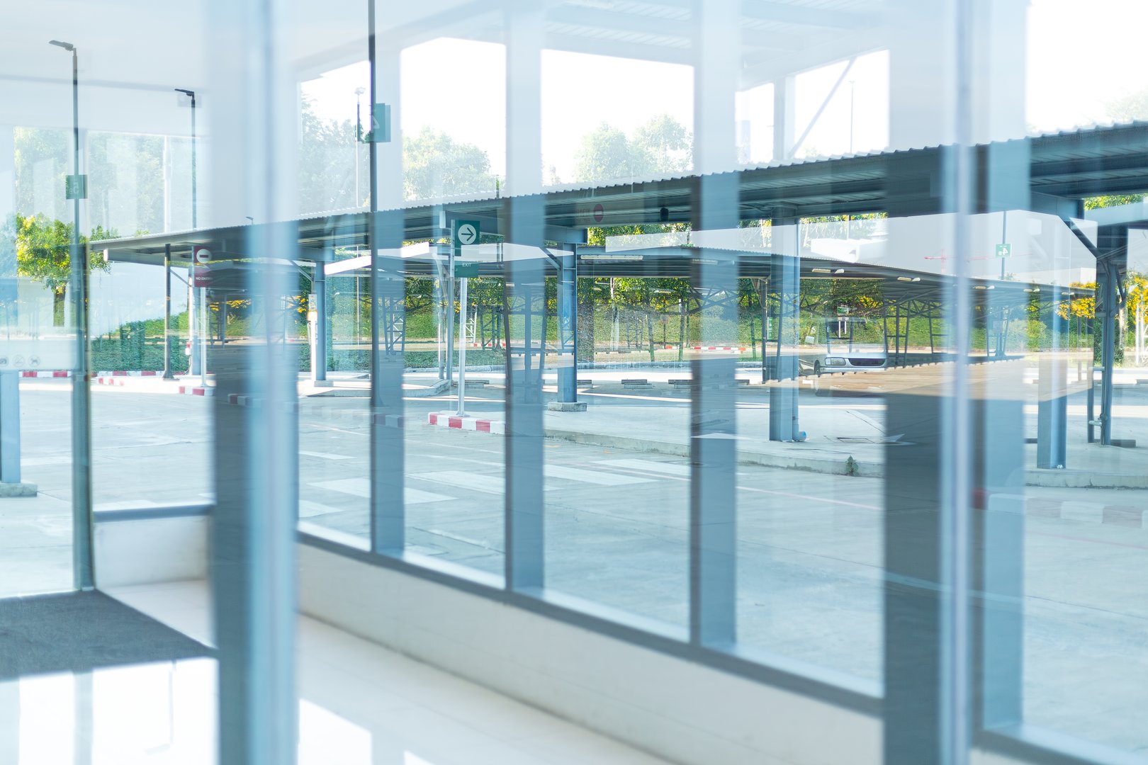Glass background and exterior building,Empty ground in front of modern glass wall facade buildings .