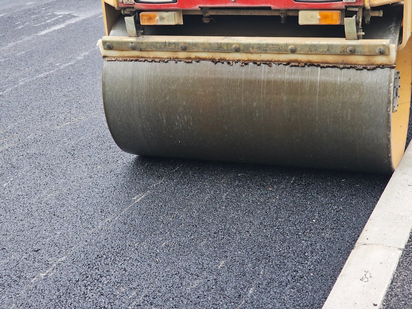 Roadworks, Road construction. Paving roller on roadworks at construction site, paving works. High quality photo