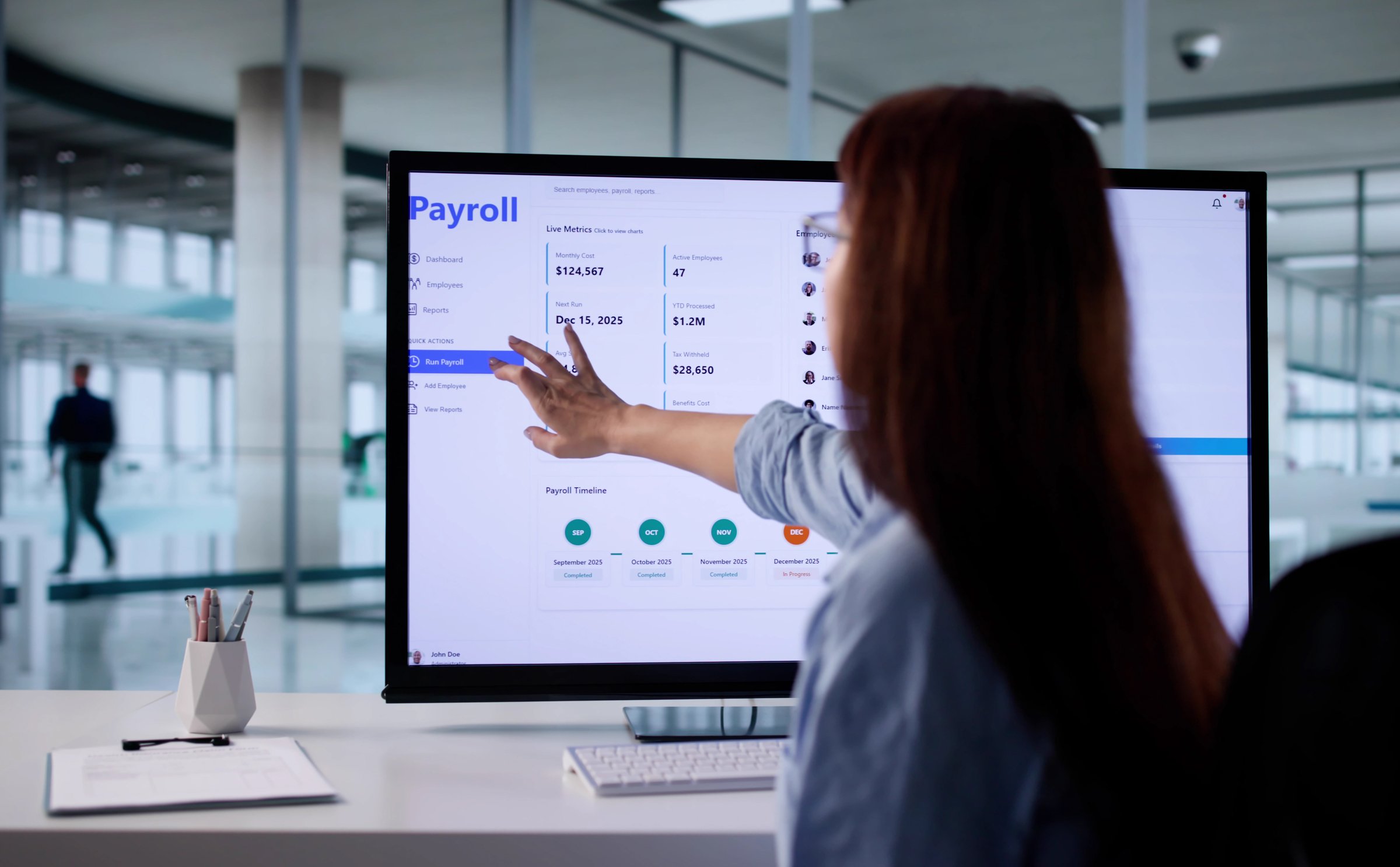 Financial Analyst Using Payroll Software To Calculate Employee Salaries Accurately.