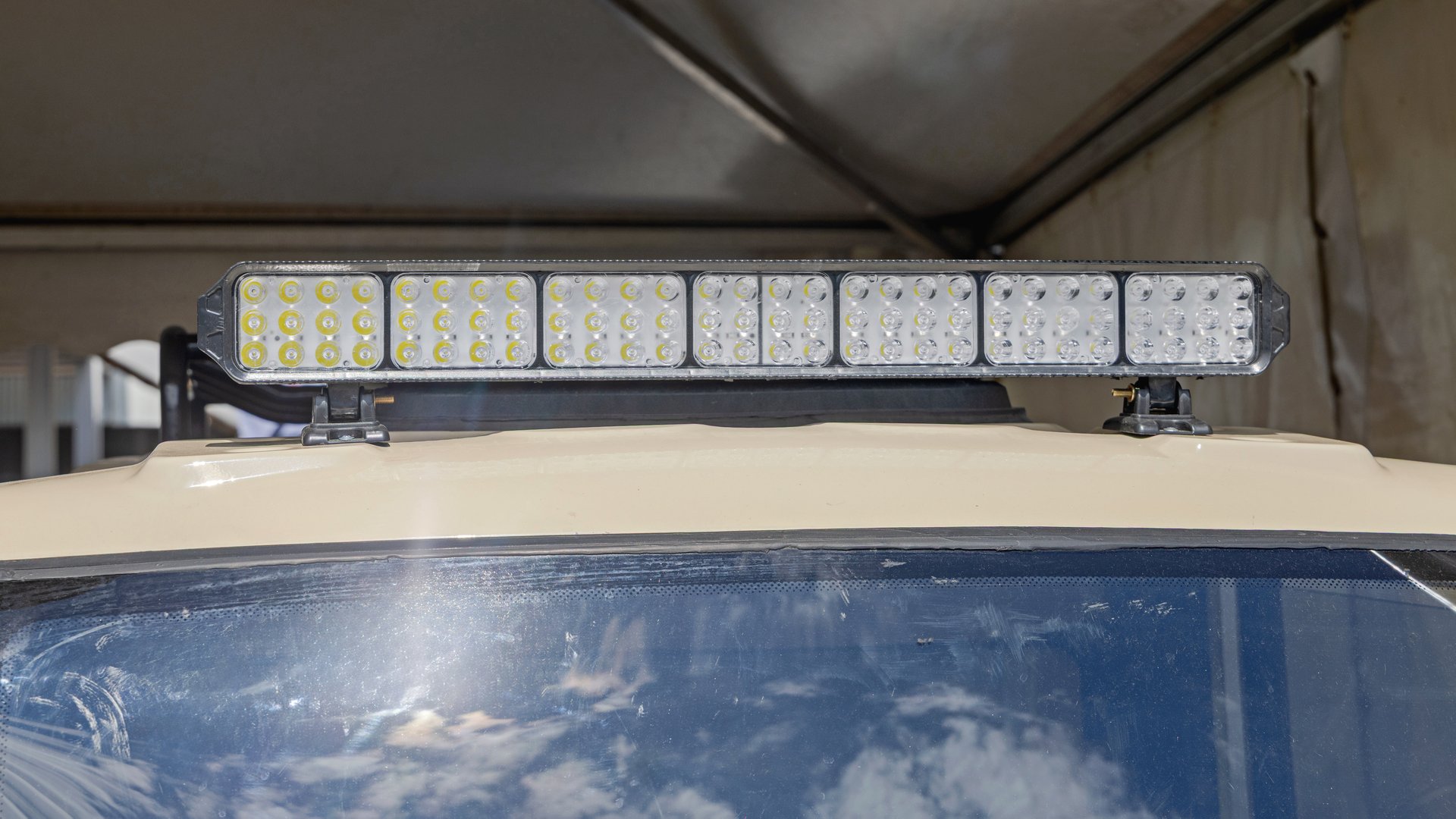 Aftermarket LED Light Bar Mounted at Roftop of Utility Vehicle Cabin