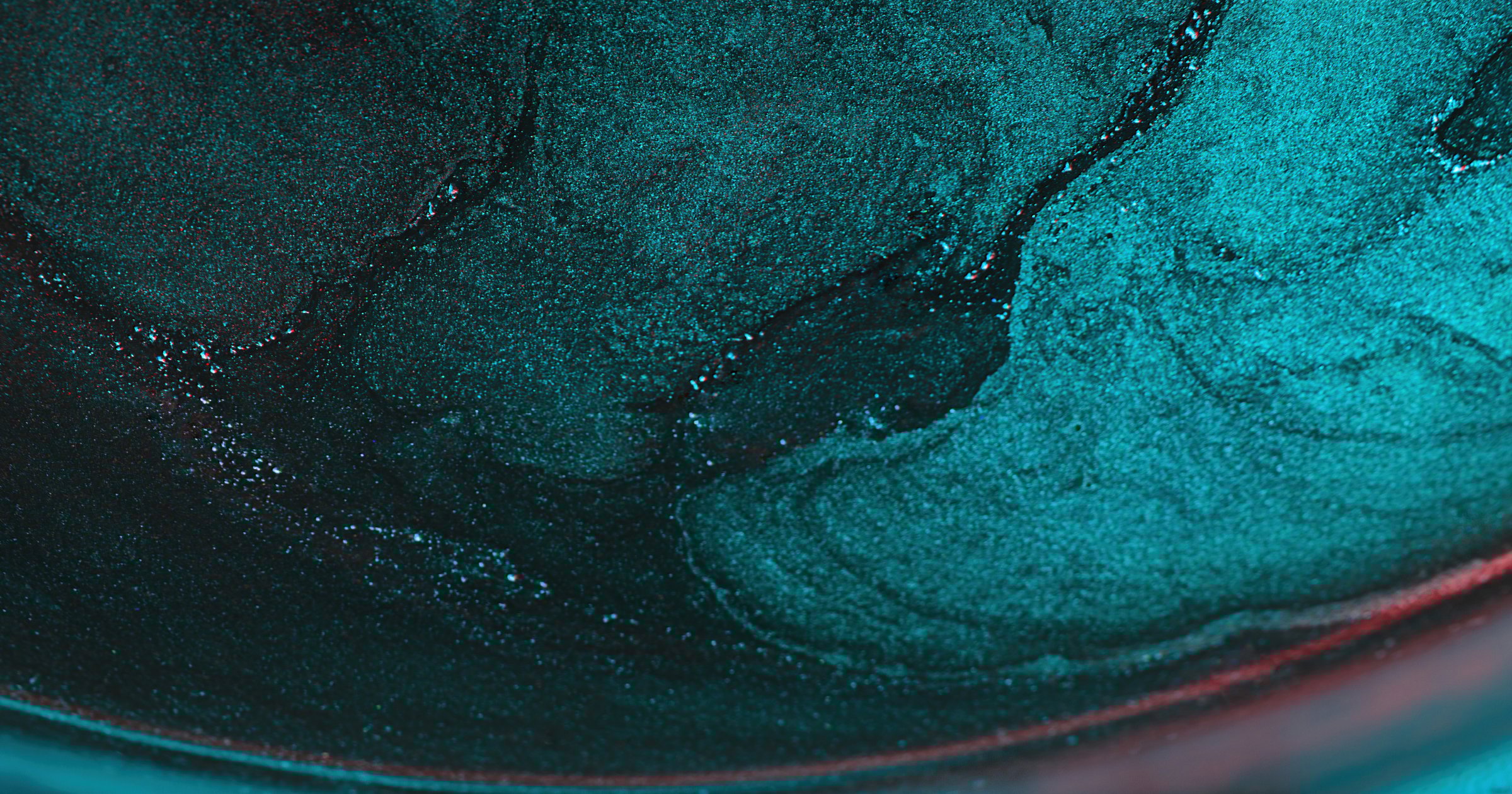 Color glitter abstract background. Blur particles. Marble texture. Defocused cyan blue red shiny light flare futuristic free space wallpaper.