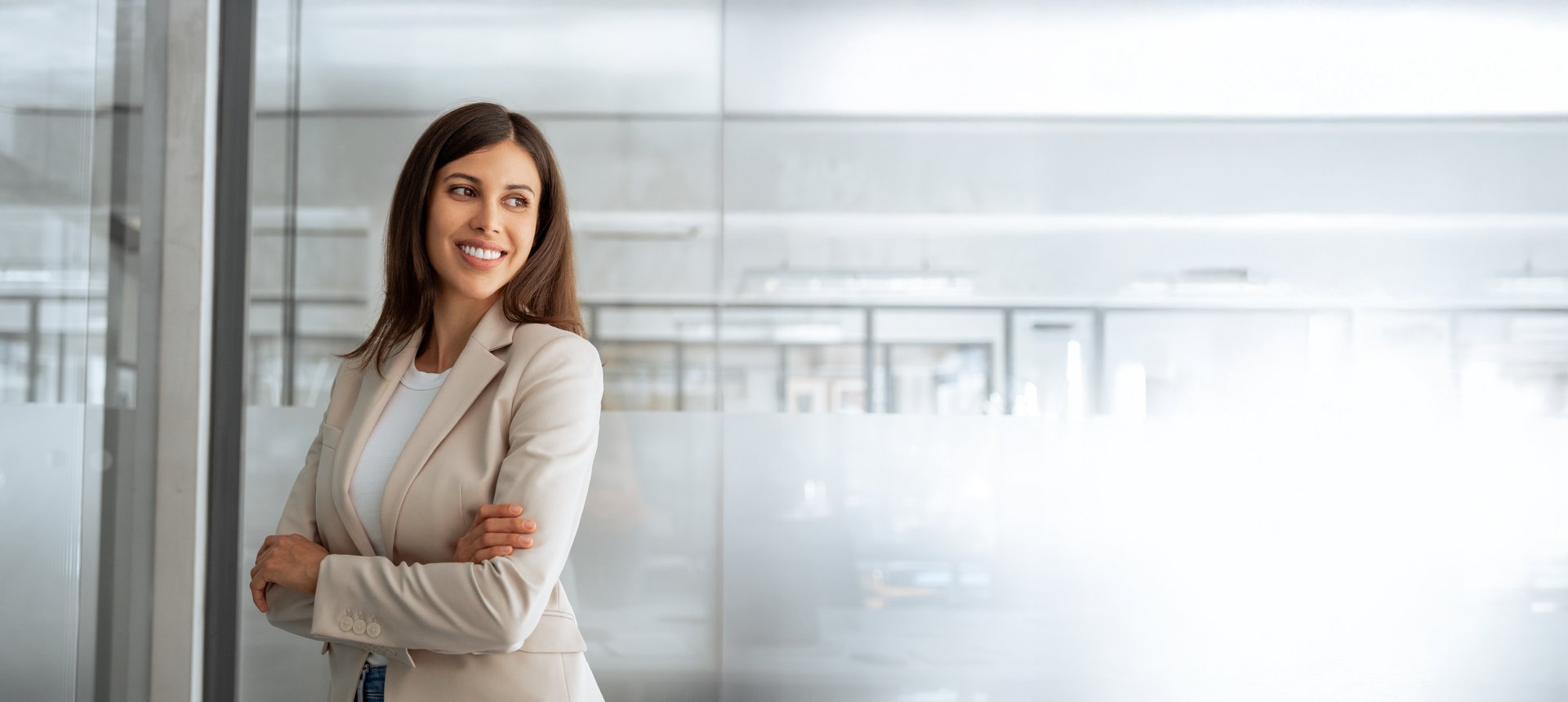 Banner portrait dreaming middle age manager adult executive CEO entrepreneur businesswoman. Smiling latin hispanic leader, middle eastern business woman standing arms crossed in office looking aside.