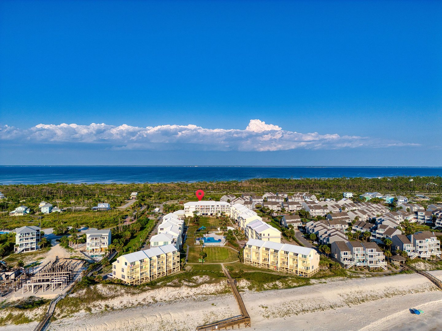 SeaCliffs Cape San Blas community pool area with Gulf views and beachfront townhomes in background