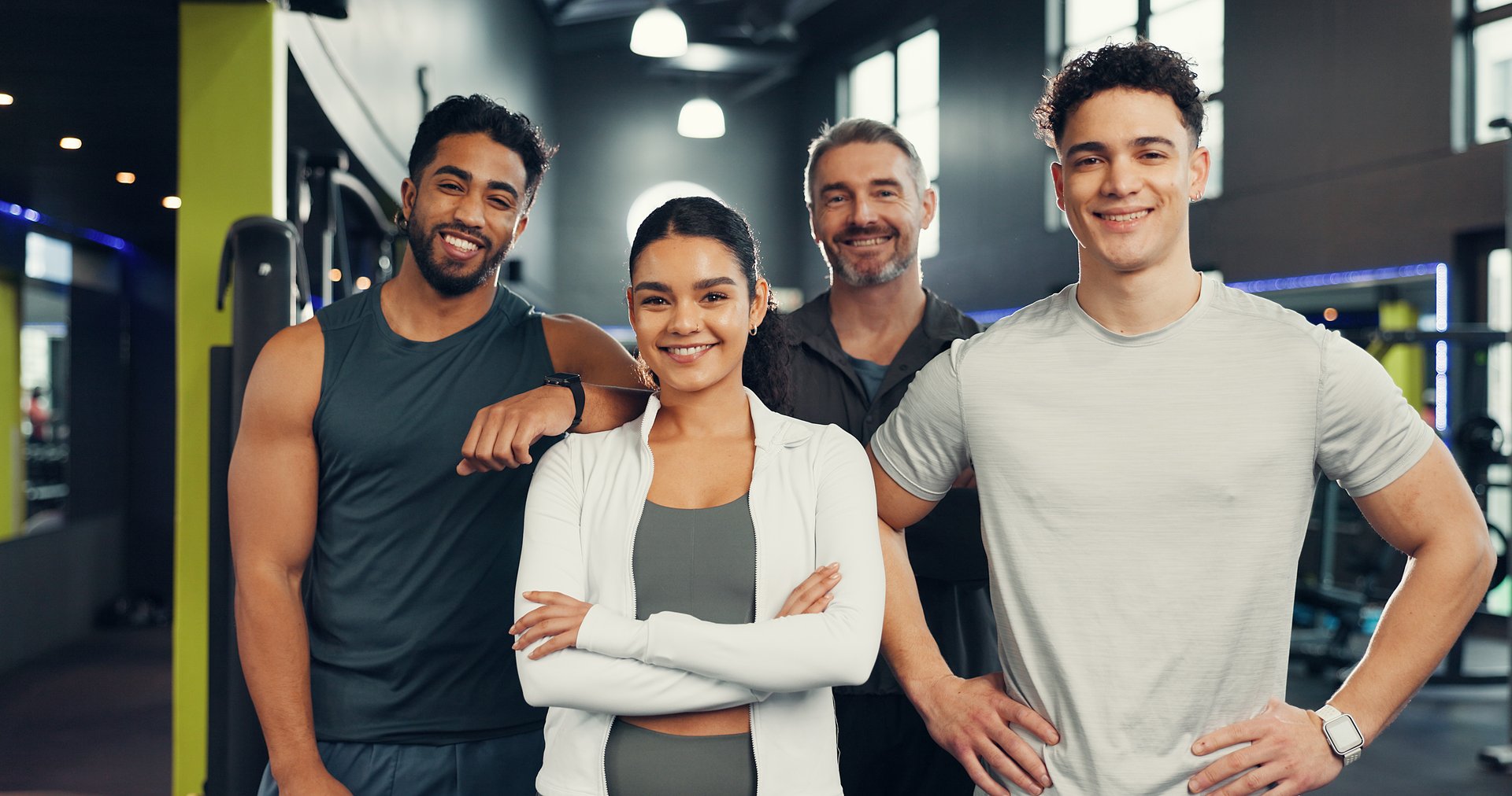 Fitness, happy and portrait of people in gym with smile for exercise, training and workout routine. Sports center, friends and men and woman with confidence for wellness, health club and support