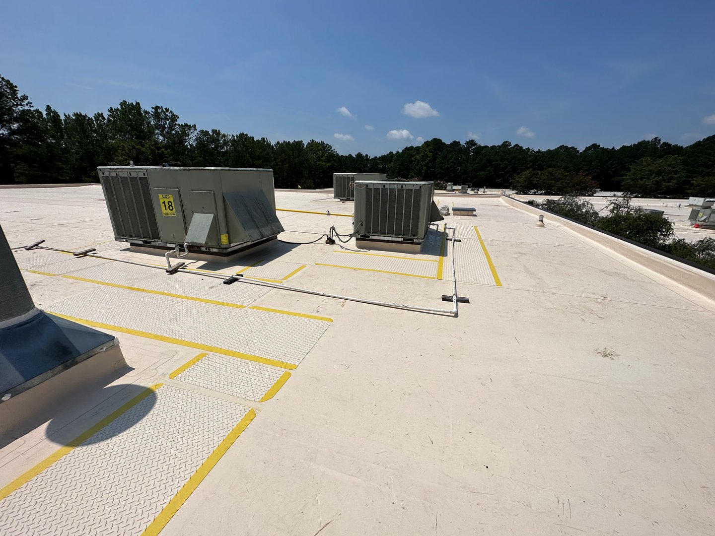 Commercial rooftop safety railing system installed on flat roof