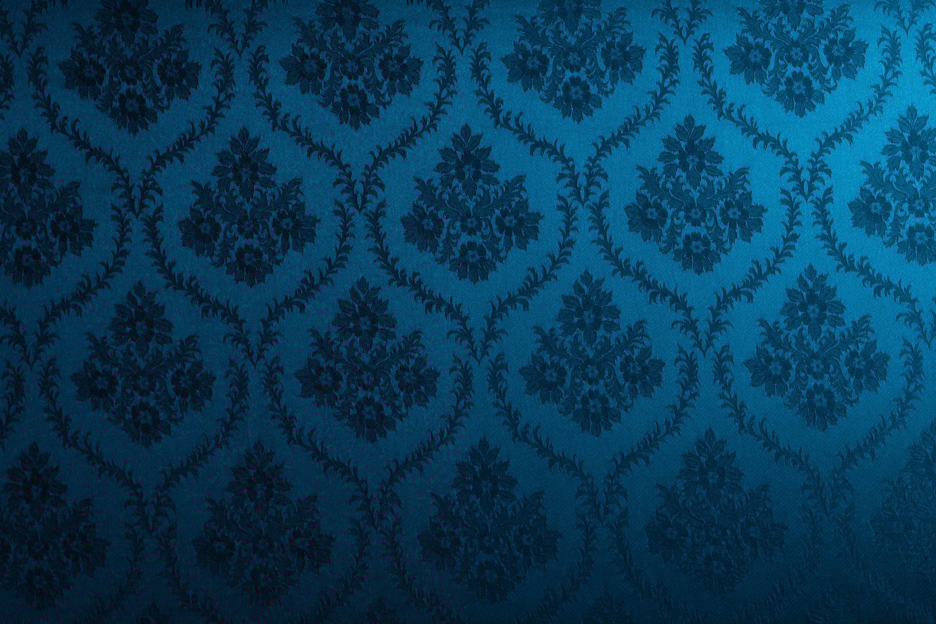 Closeup of blue victorian vintage textured textile wall for design purpose