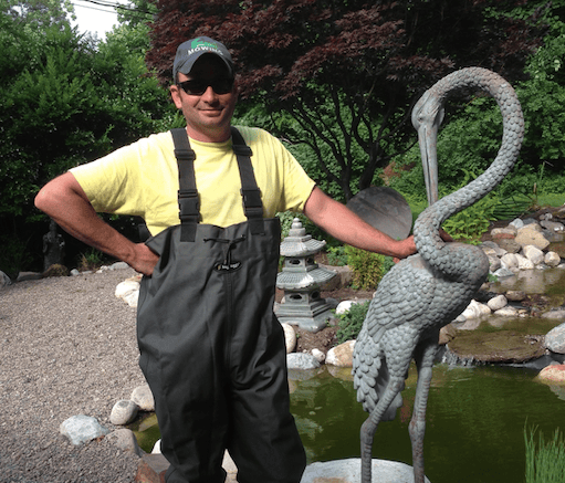 Gardener maintaining lawn edge