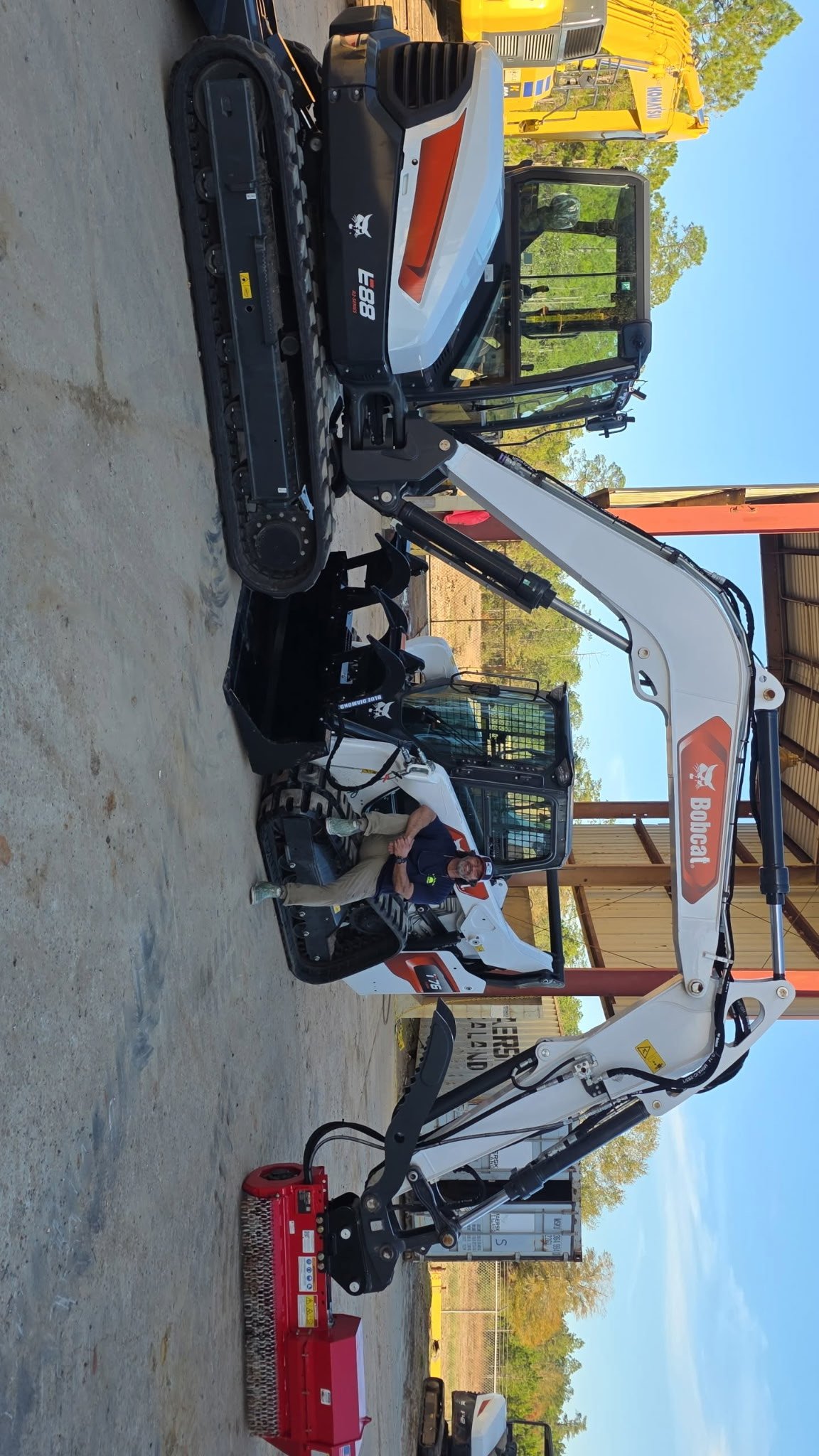 Professional tree service and land clearing equipment in action