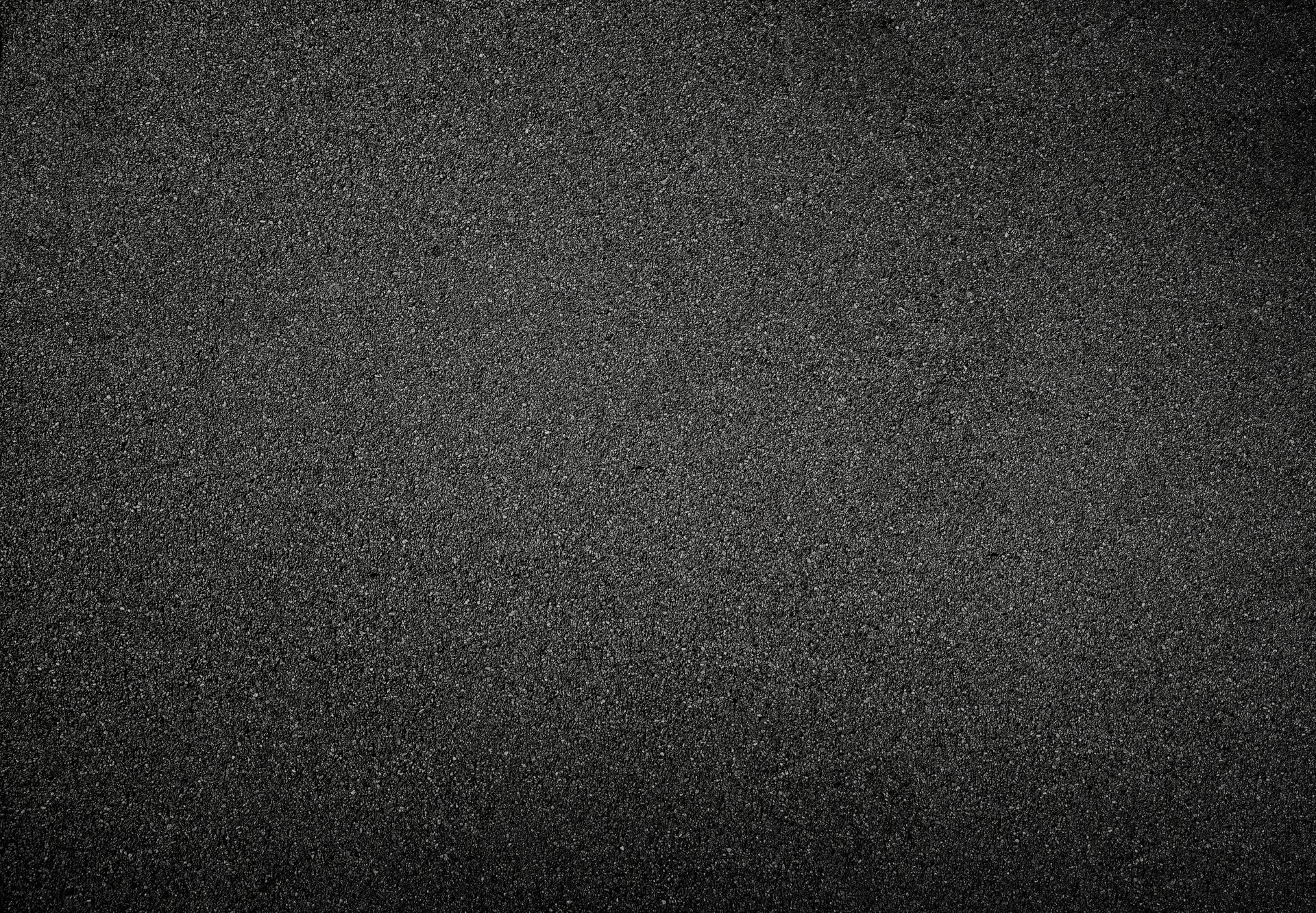 background texture of dark gray asphalt, top view