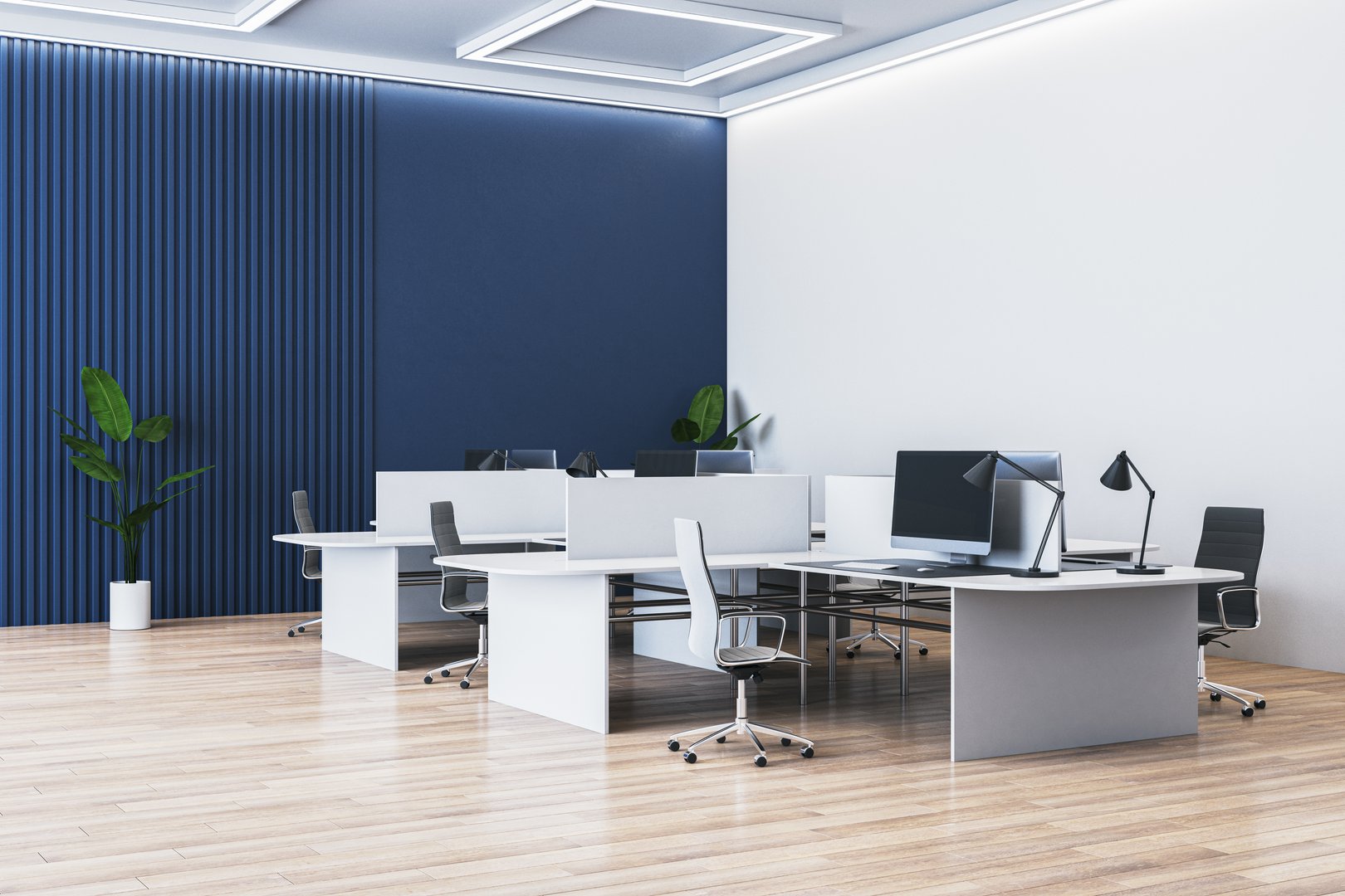 Empty, modern office interior with desks, chairs, and computers. Blue and white walls, wooden floor. Concept of business workspace. 3D Rendering