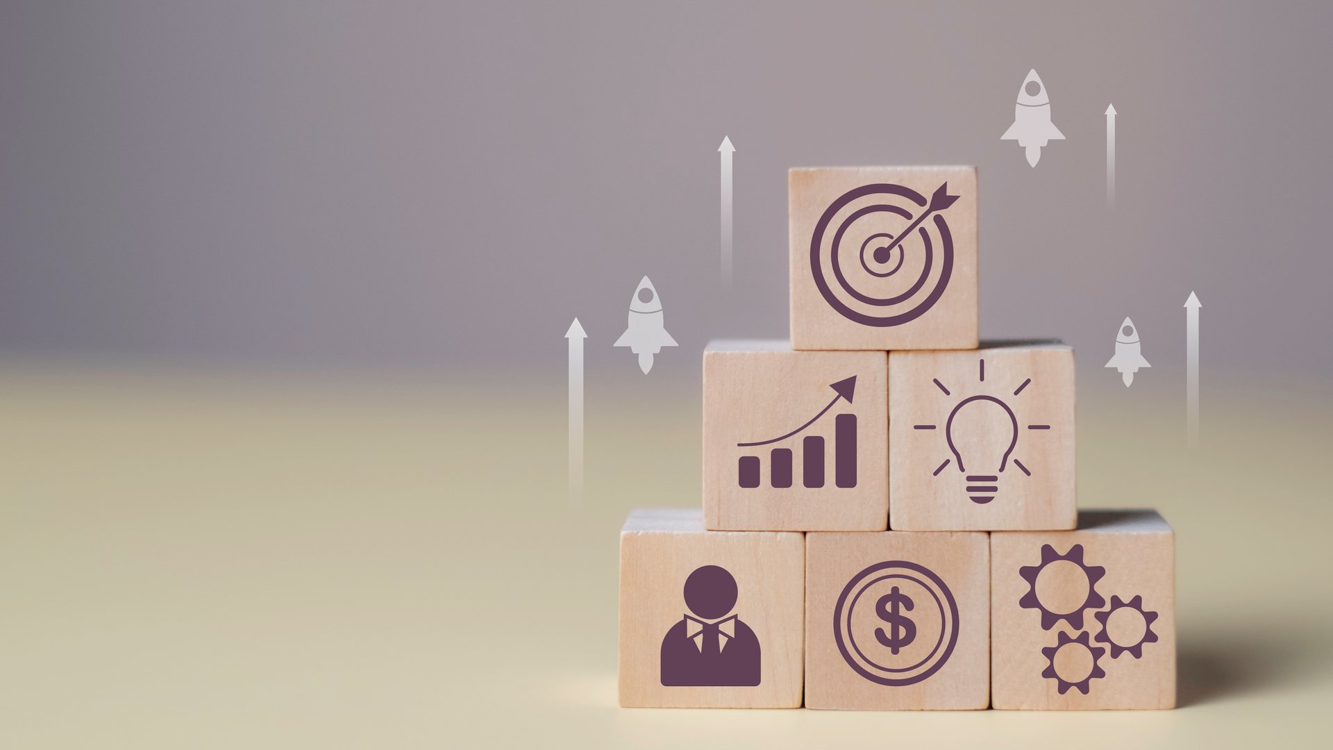 Rocket launch as a symbol of startup success in wood cube. Creativity, innovation, and strategic planning to reach business goals, project targets, and market trends.