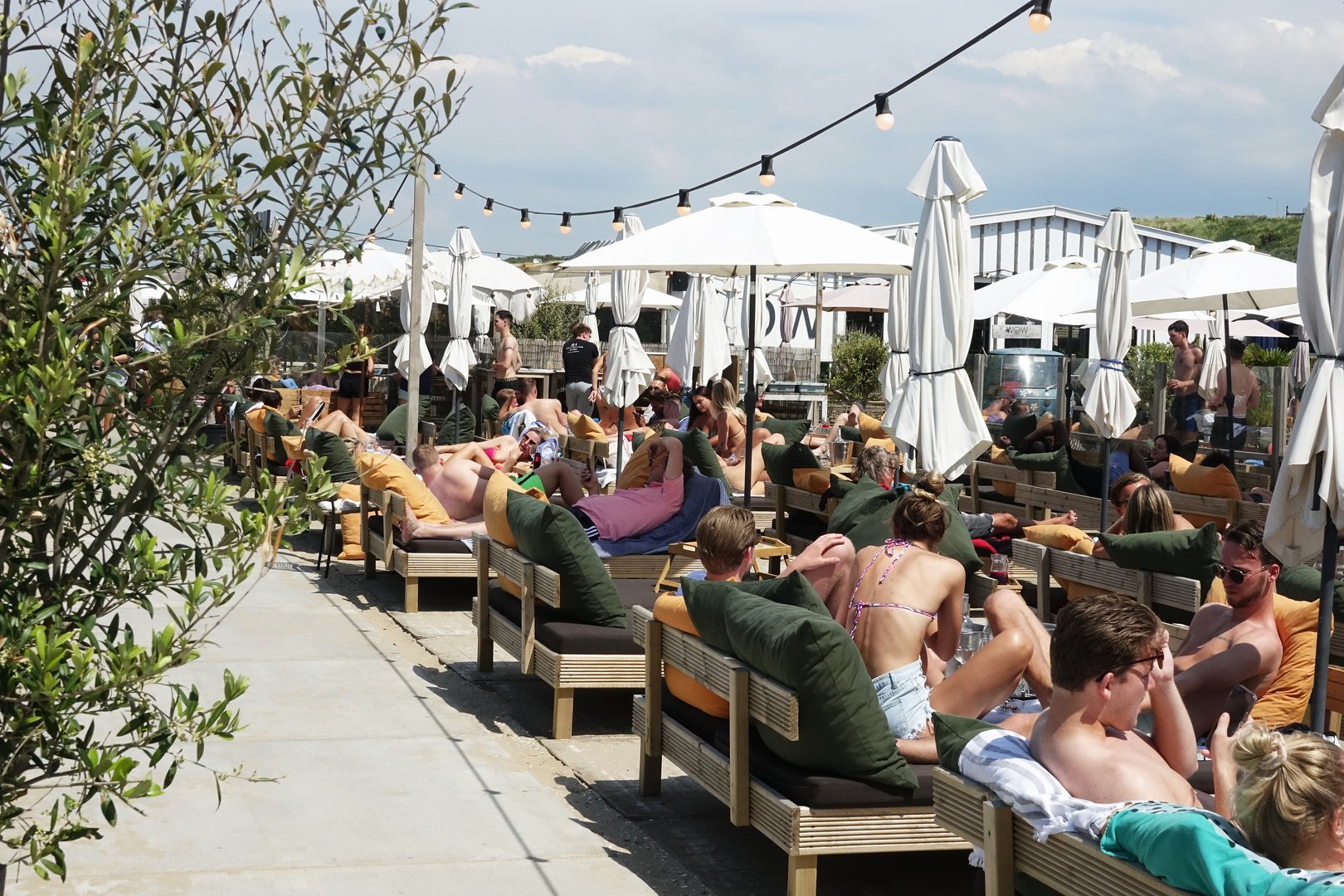 Netherlands. The Hague.June 29, 2022. Bathing people on a sunny day in a beach club along Zwarte Pad in Scheveningen