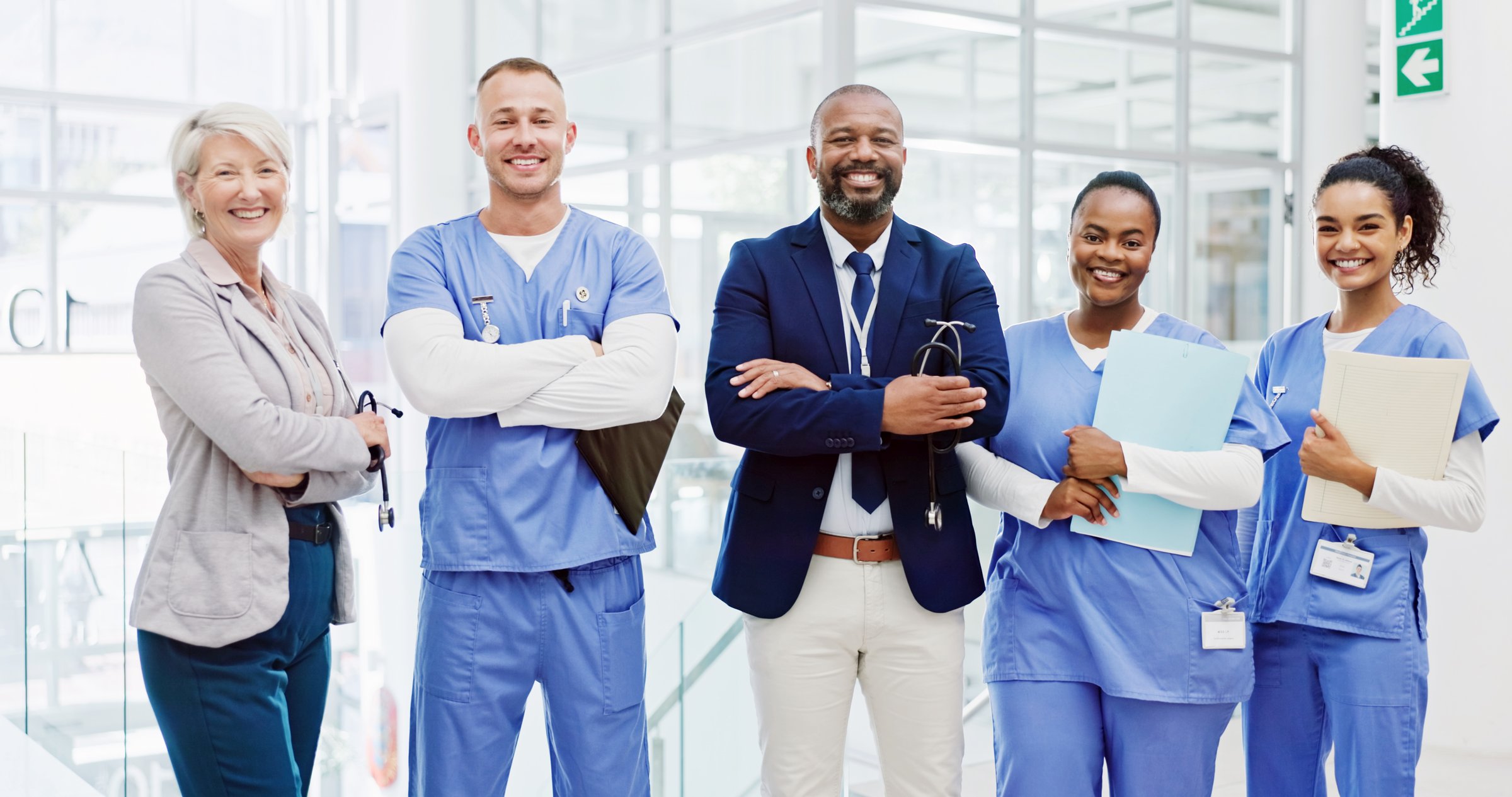Business people, portrait or medical team with confidence for healthcare service, progress or development at hospital. Group, board directors and nurses with smile, arms crossed or about us at clinic