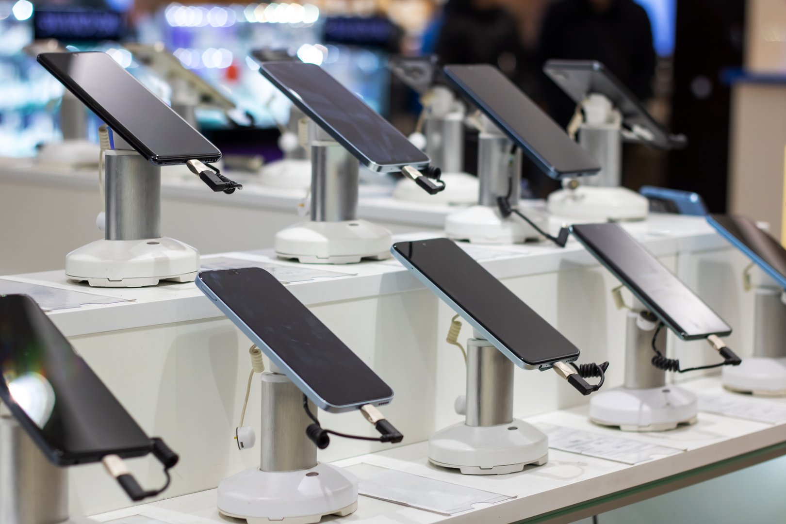 A row of mobile phones in a shop window close up