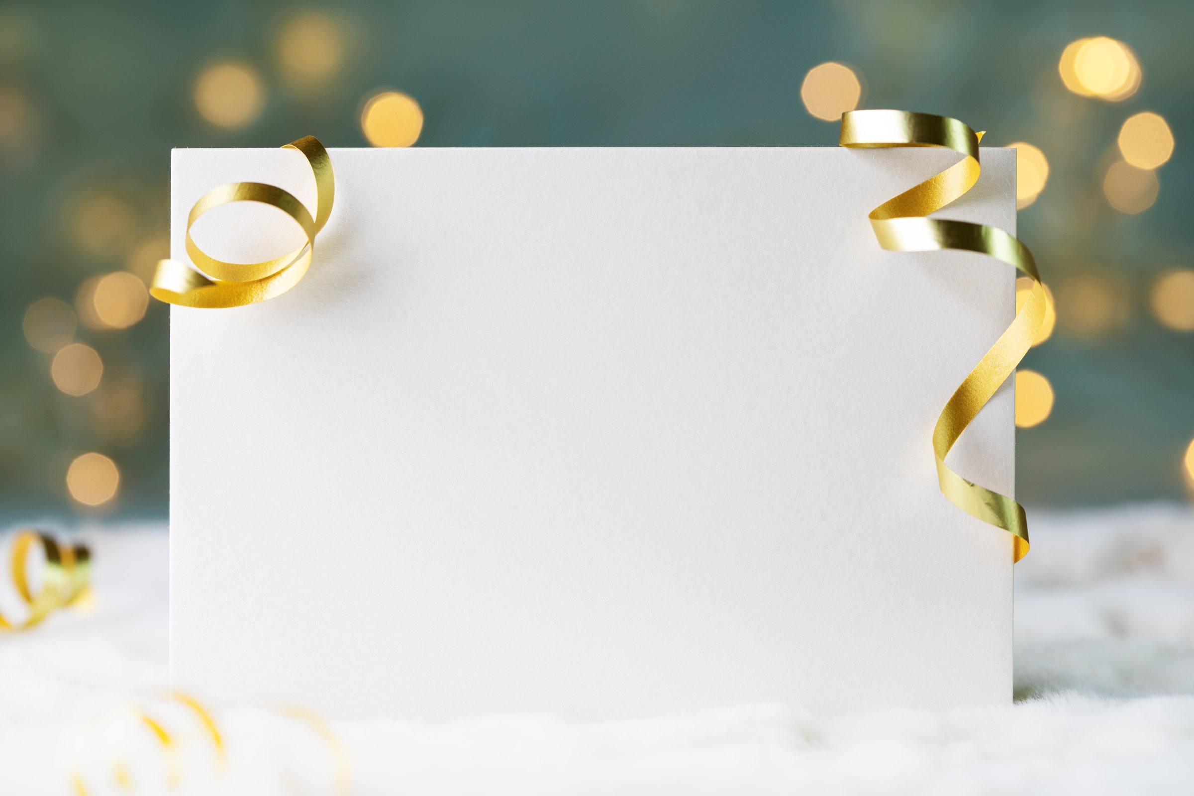 Holiday mockup with Christmas decorations on bokeh background. Greeting card template.