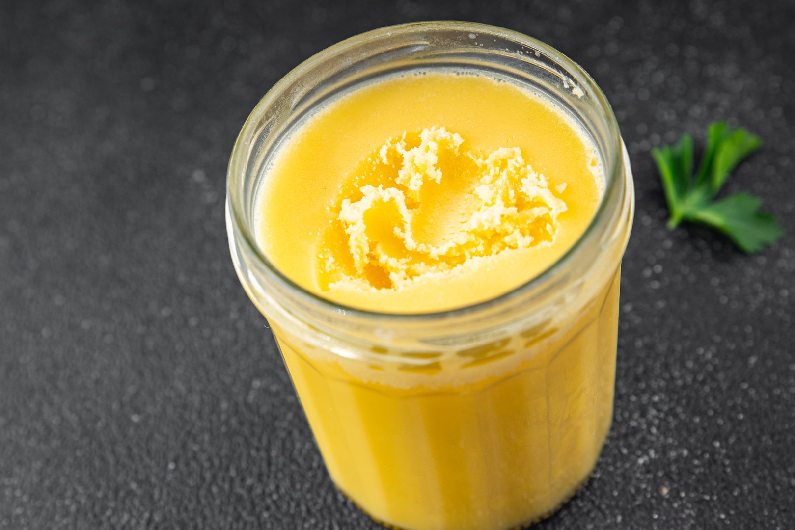 Ghee butter or clarified butter delicious gourmet food background on the table rustic food top view copy space keto and paleo diet vegetarian and vegan food