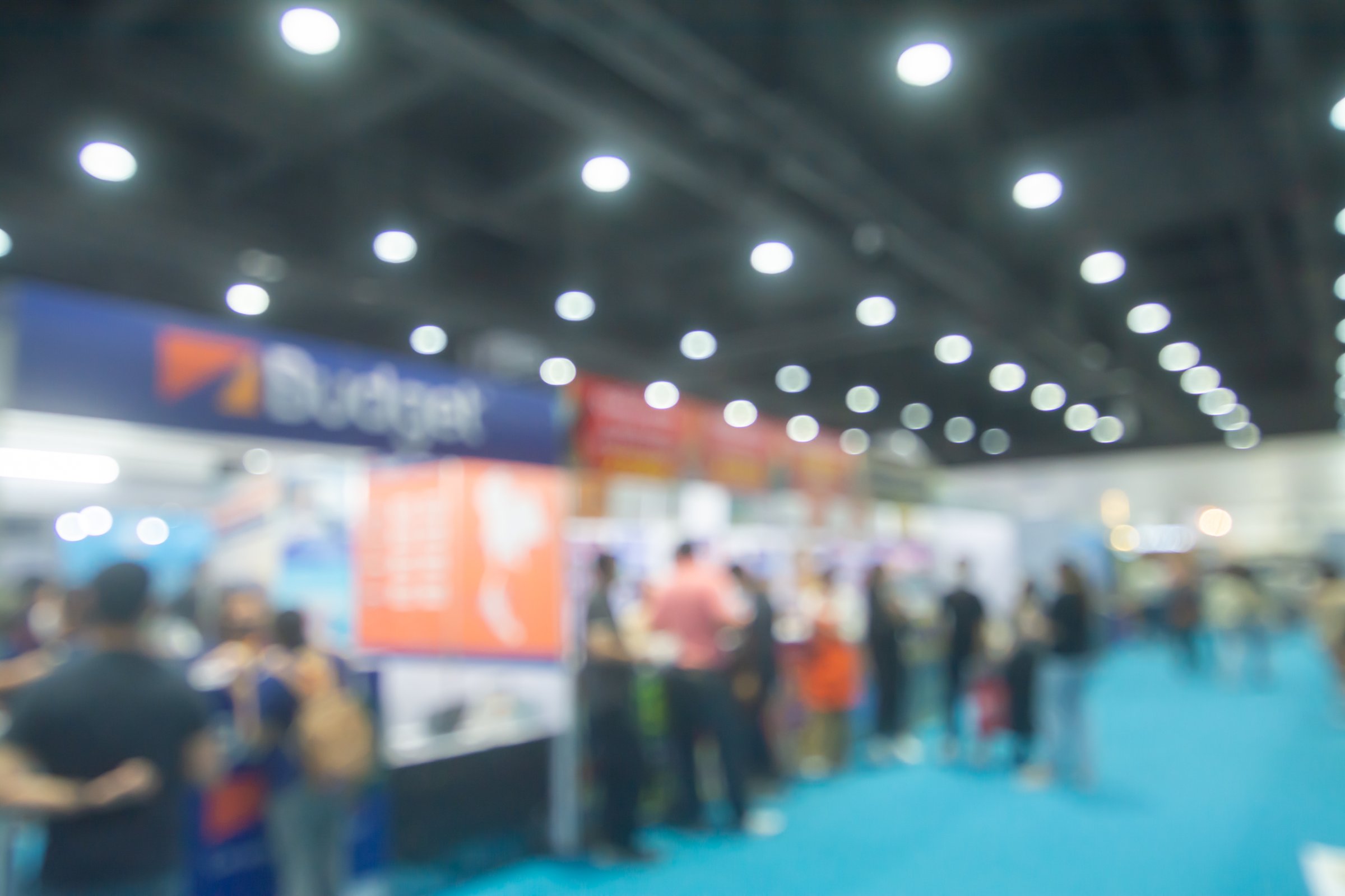 Abstract people walking in exhibition blurred background