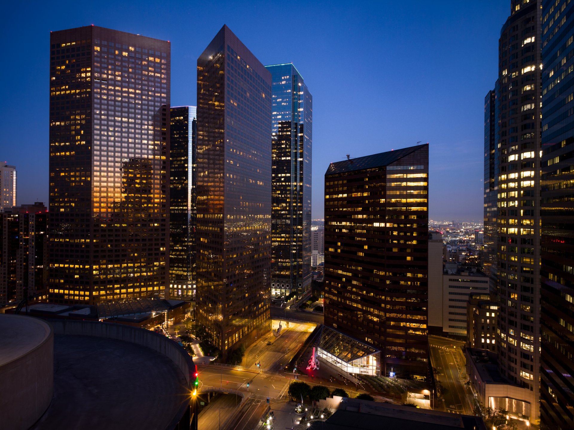 Night time photograph of buildings and skyscrapers in downtown cityscape during twilight evening hours in Downtown Los Angeles