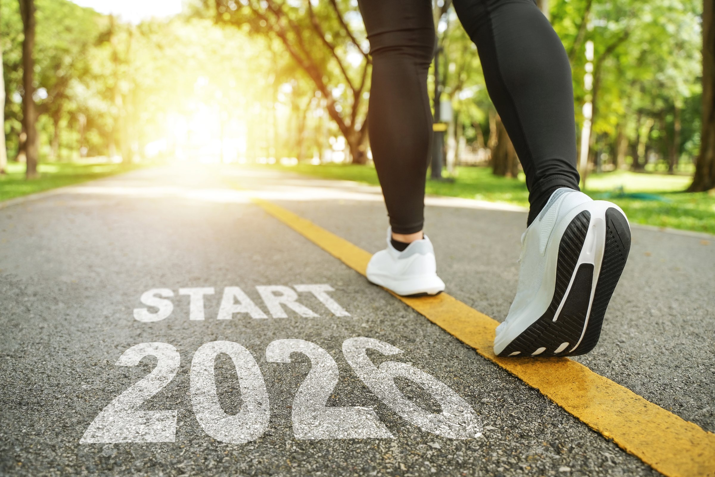 New Year 2026 concept. The beginning of success. A female runner is setting off for the new year.