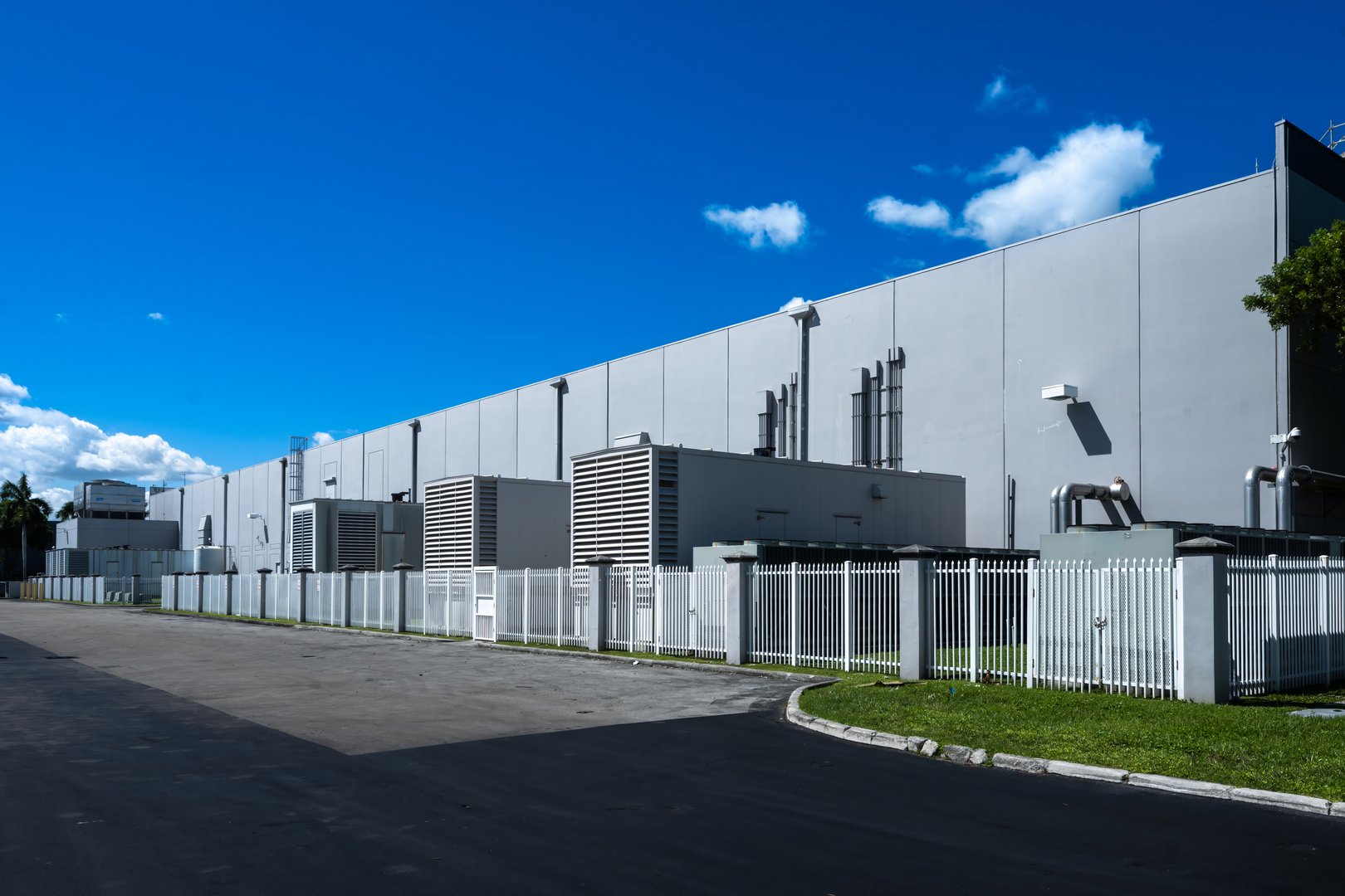 Standby diesel generators outside warehouse building