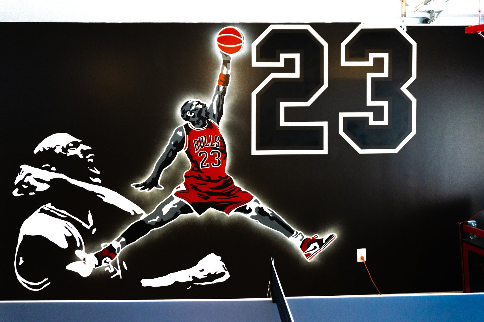 Wall mural featuring a stylized basketball player wearing a Bulls jersey, number 23, with a large 23 in the background.