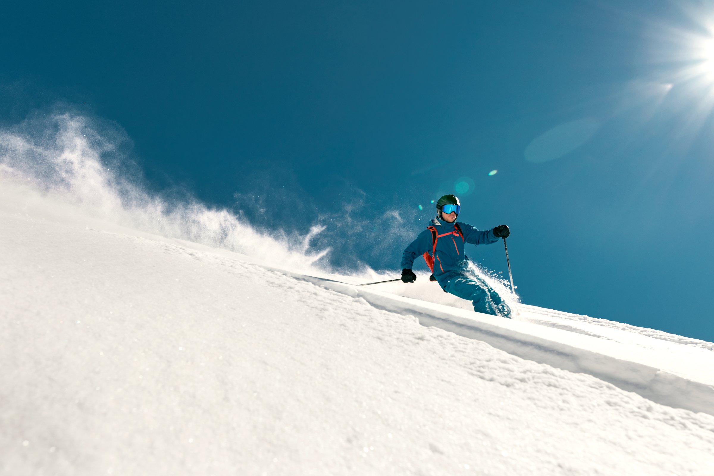 Very fast skier rides over ski slope. Freeride concept
