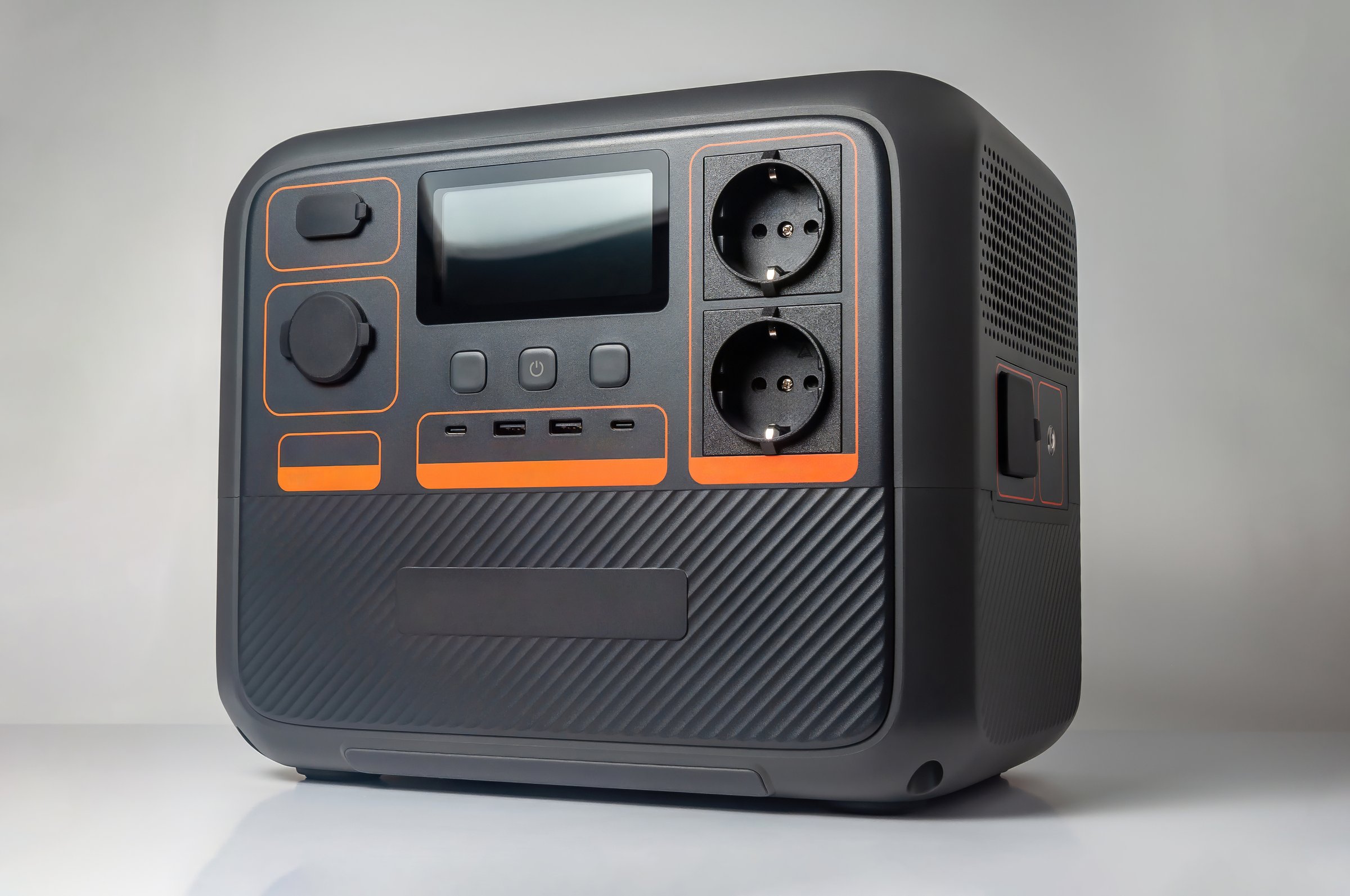 A close-up shot of a portable power station, displaying its various ports, and features. Ideal for off-grid power solutions.