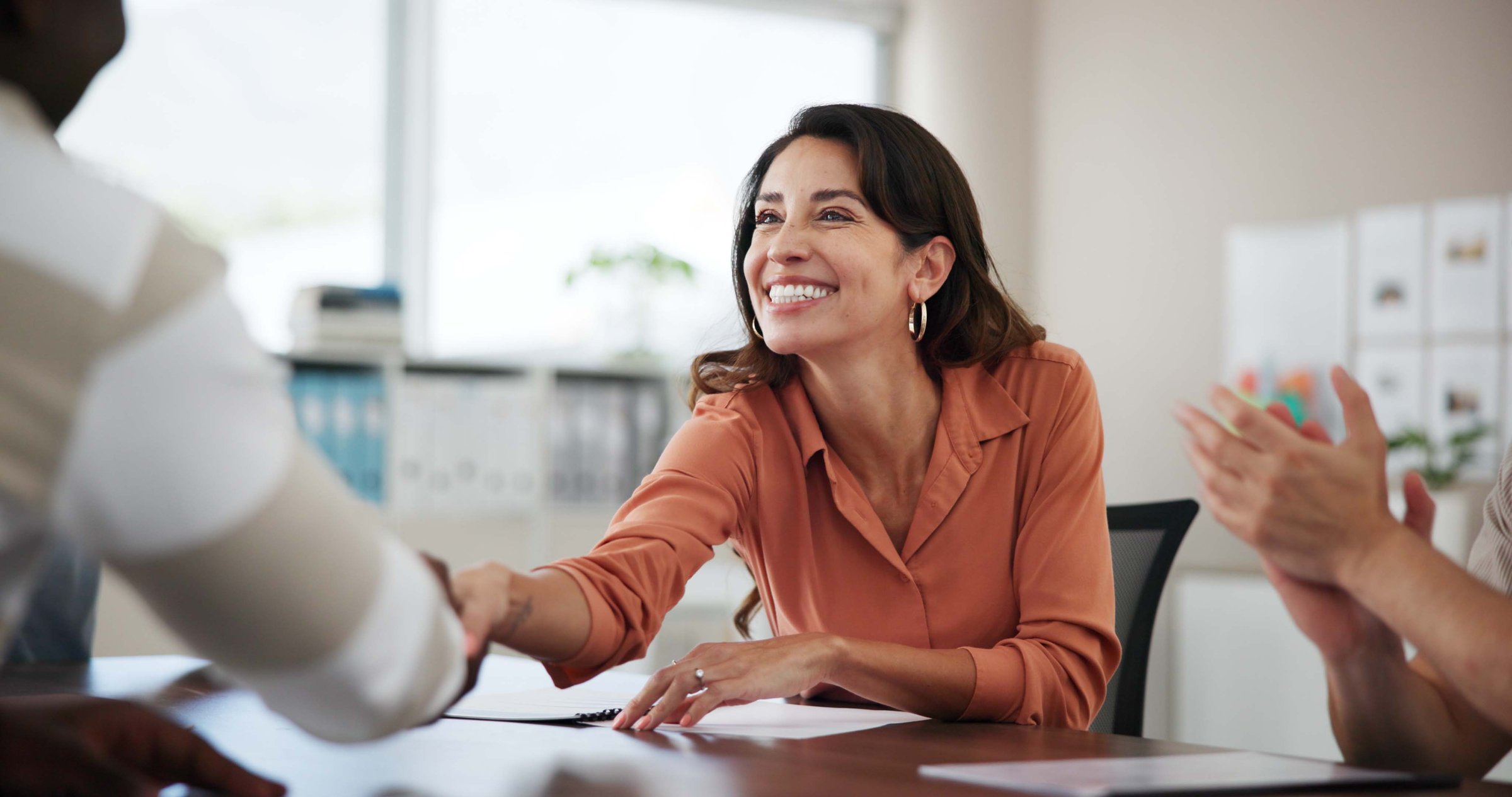 Applause, group and handshake for onboarding, boardroom and achievement for interview in company. Clapping, success and people with accomplishment for project, congratulations and shaking hands